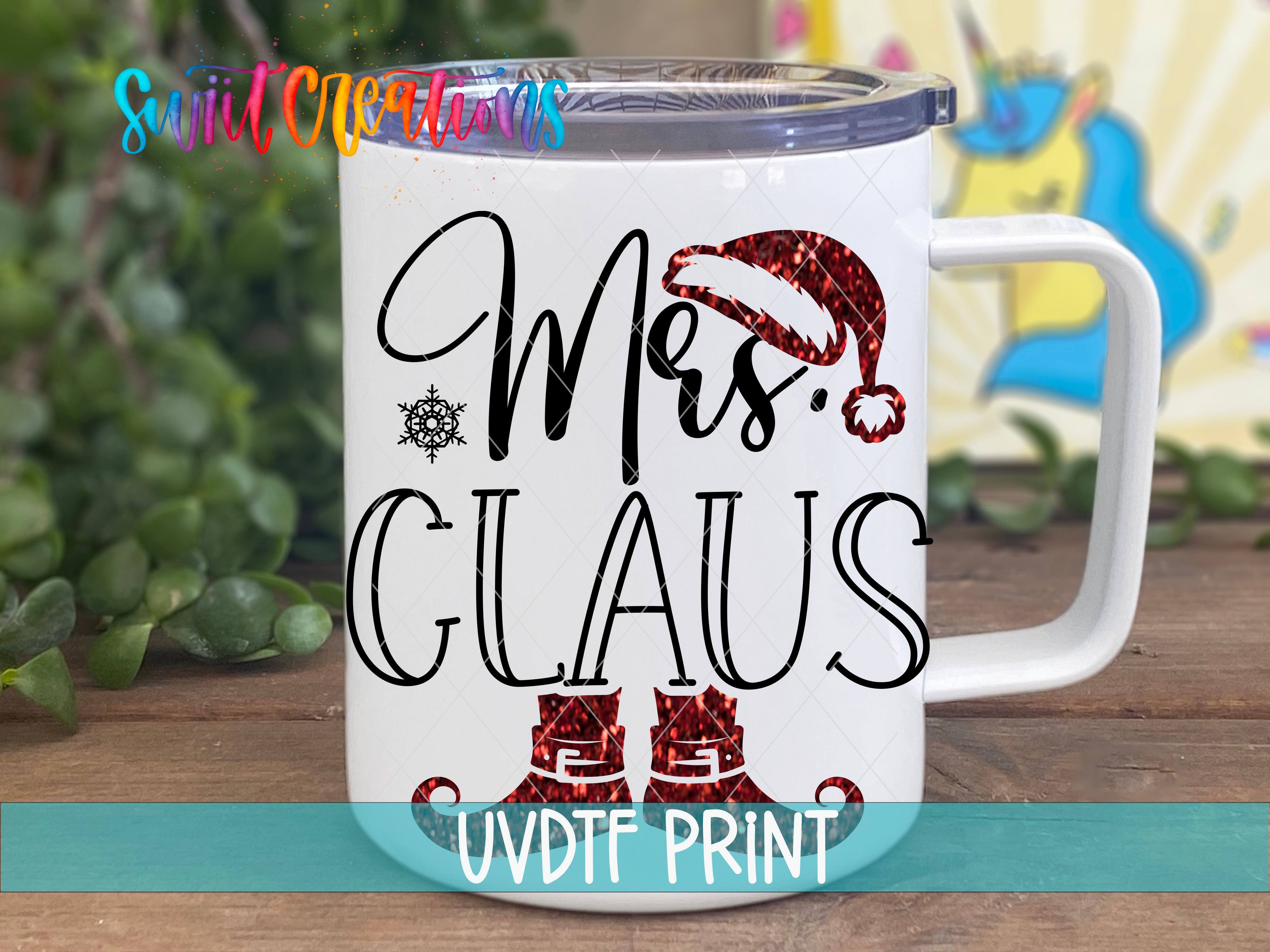 A white mug with a design featuring a Santa Claus hat and the text "Mrs. Claus" printed on it.