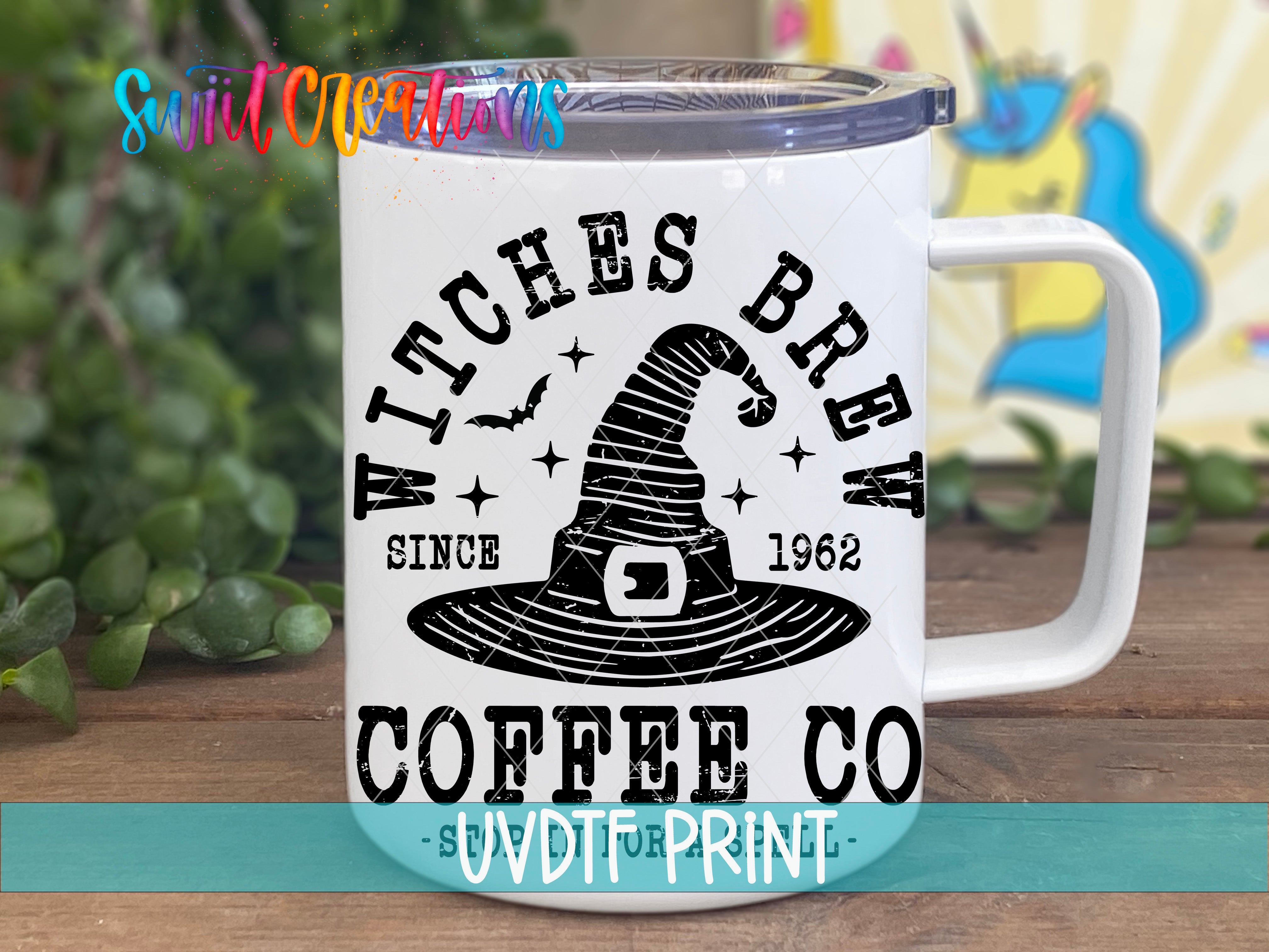 A white coffee mug with a black and white design featuring a witch's hat and the text "WITCHES BREW COFFEE CO" printed on it.