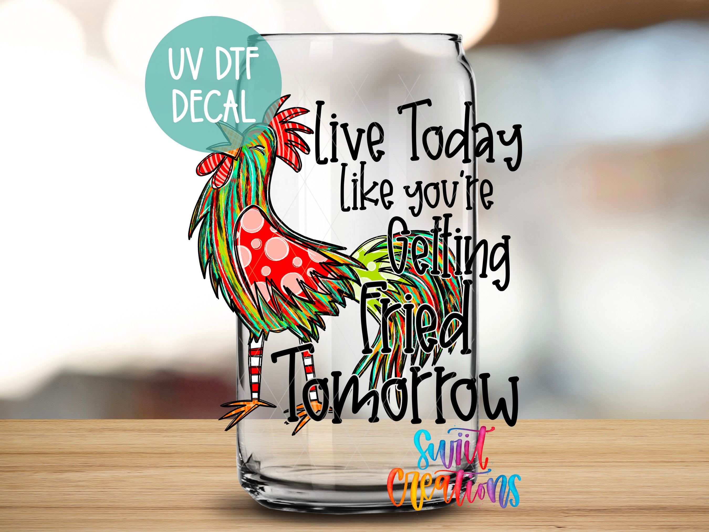 a glass with a rooster painted on it