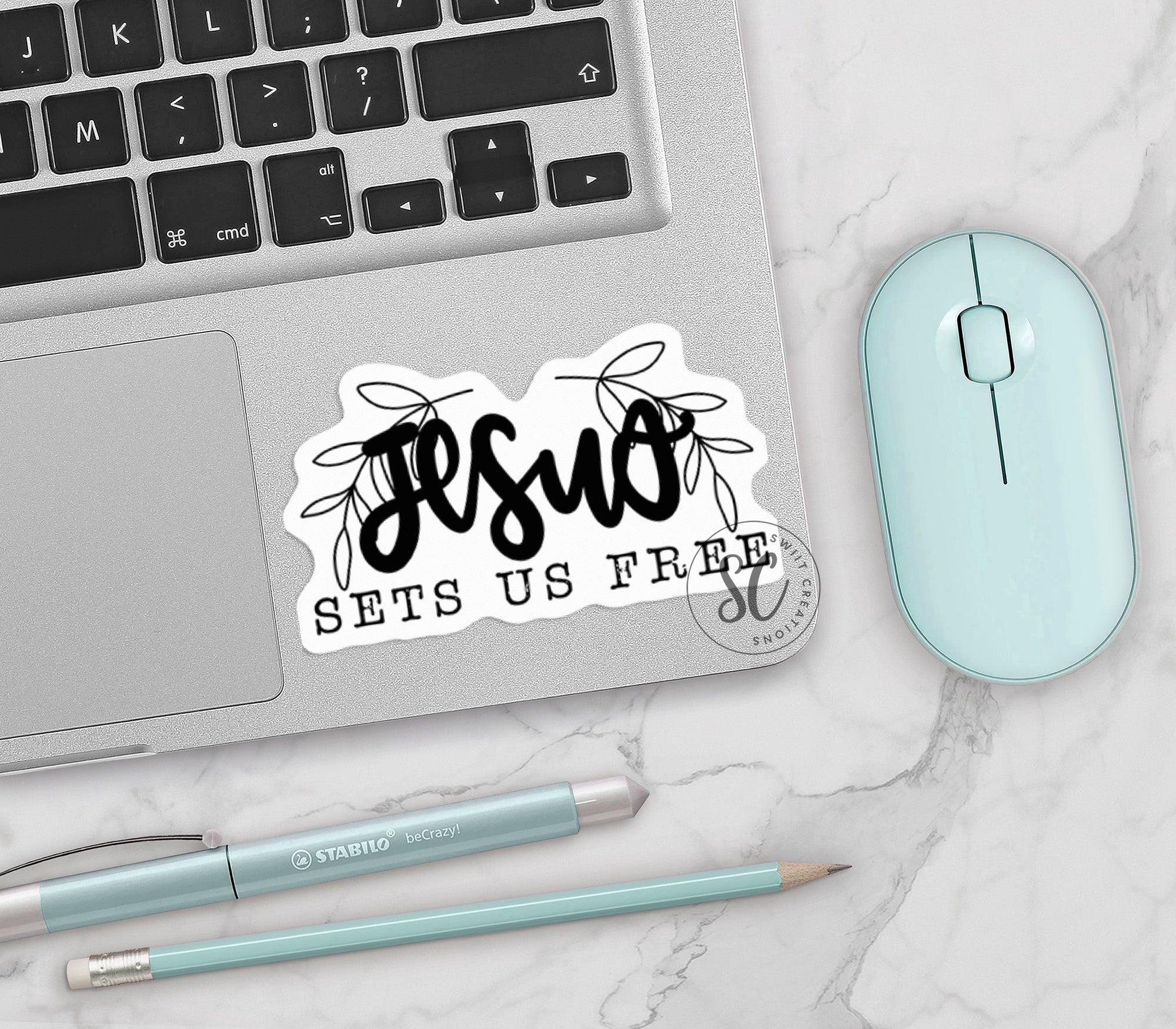 a laptop computer sitting next to a mouse and keyboard