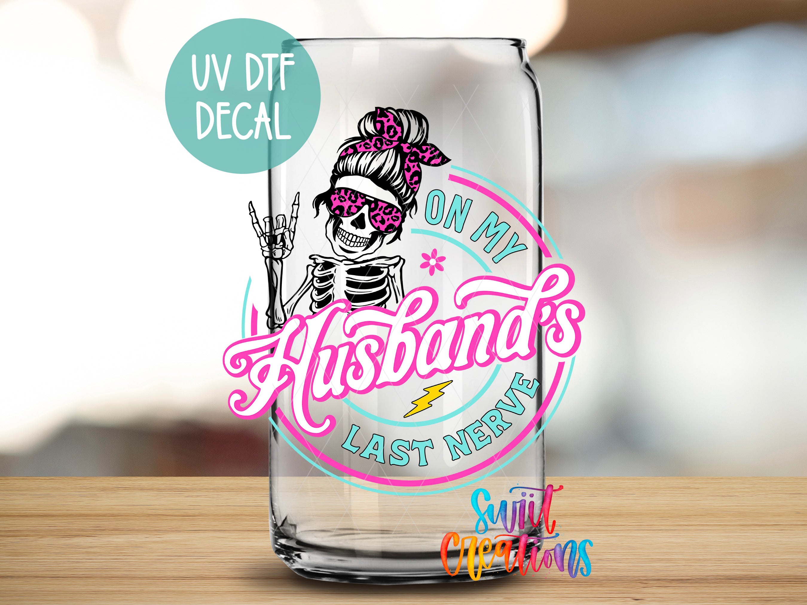 a glass with a sticker of a skeleton on it