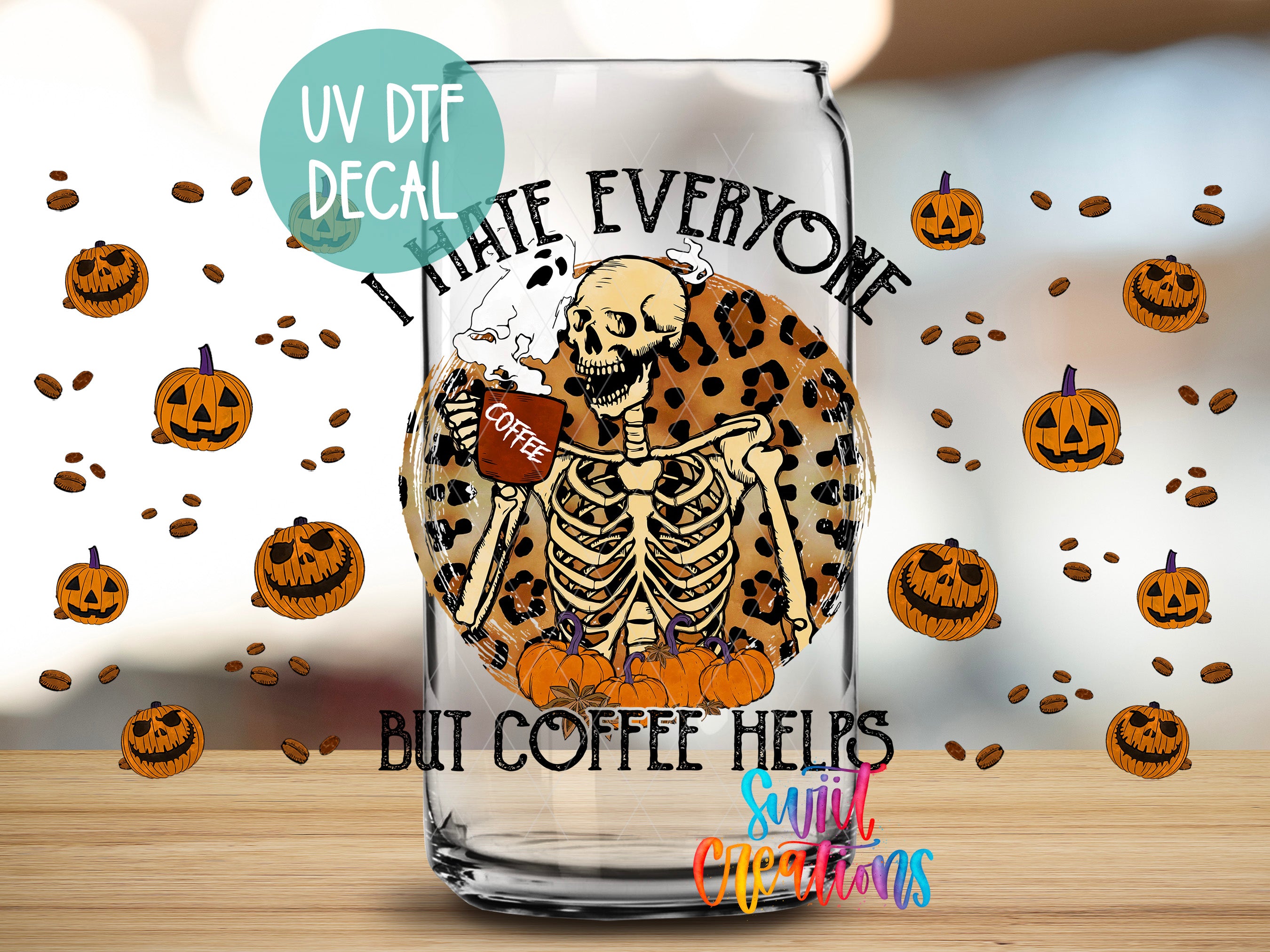 A glass mug with a skeleton holding a coffee cup, surrounded by Halloween pumpkins and coffee beans, with the text "I hate everyone but coffee helps" and "soul creations" printed on it.