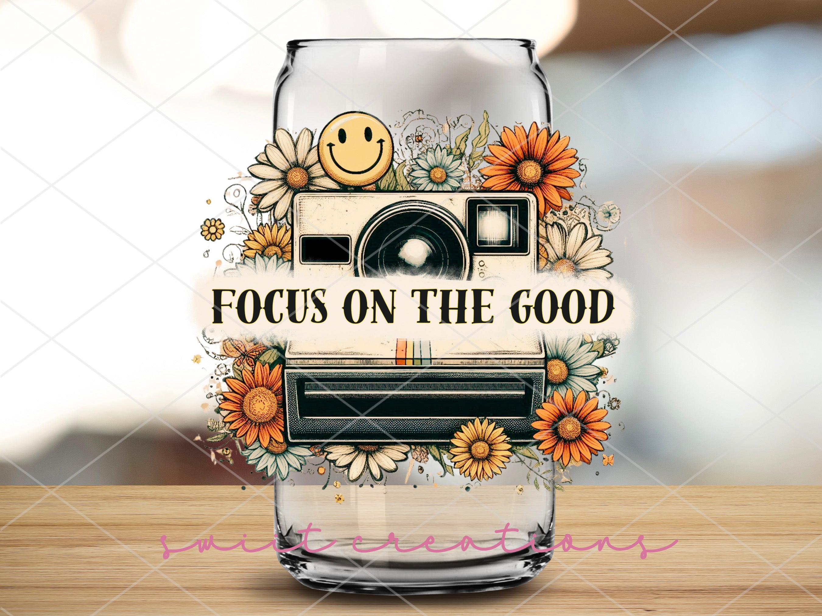 a glass with a picture of a camera on it