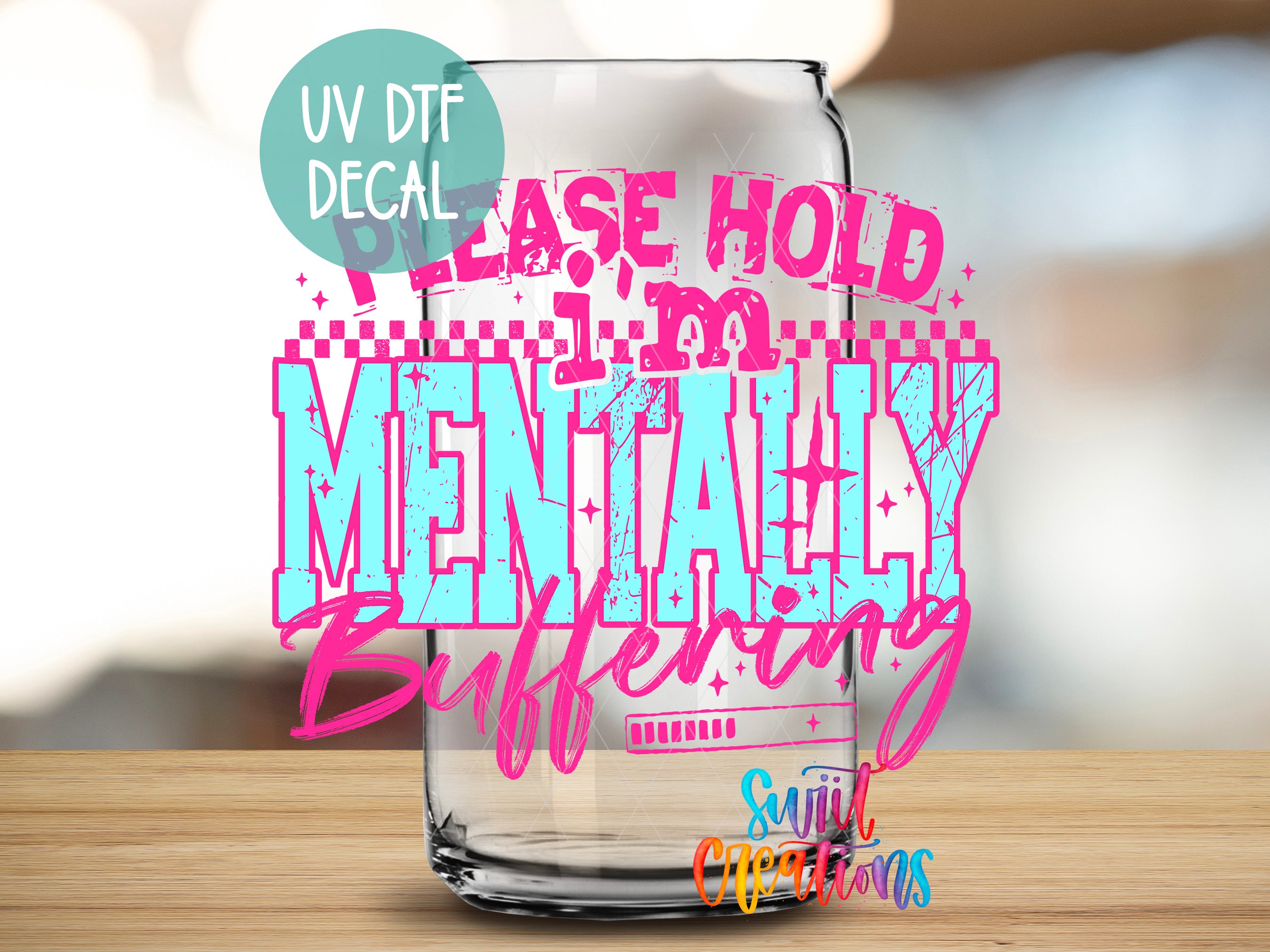 a glass with a message written on it, which reads "Please hold mentally buffering".