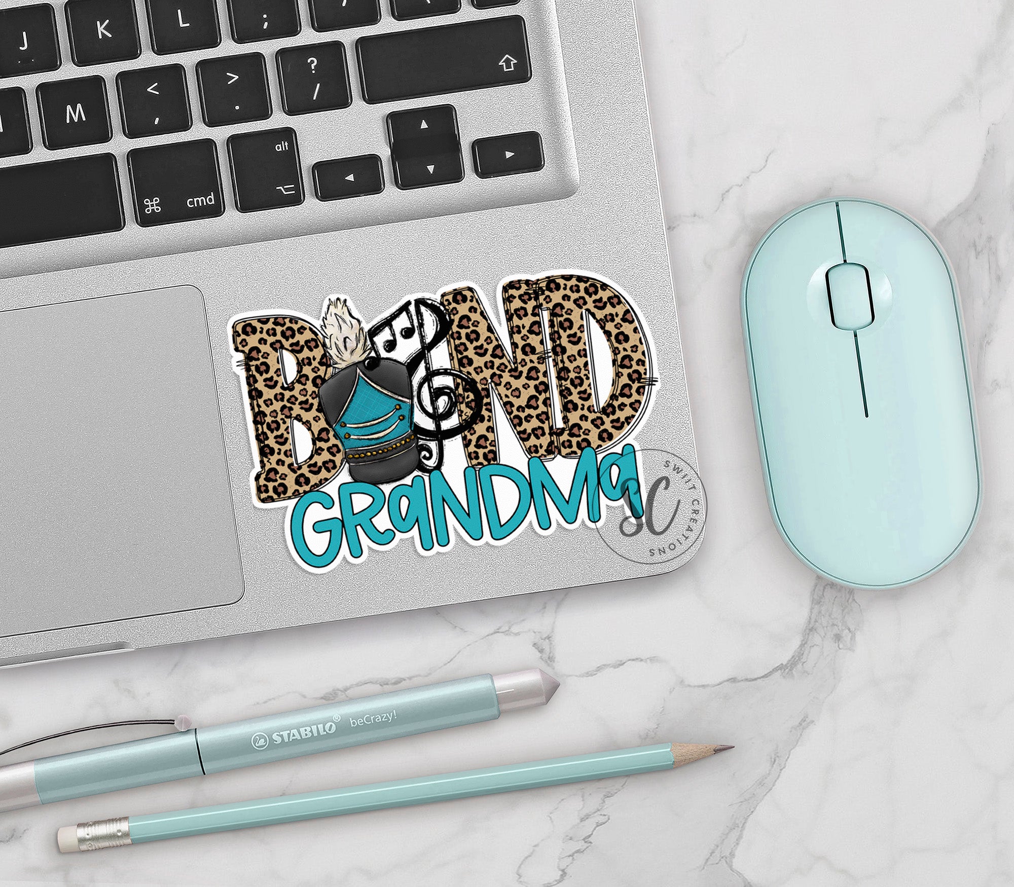 a laptop computer sitting on top of a white table