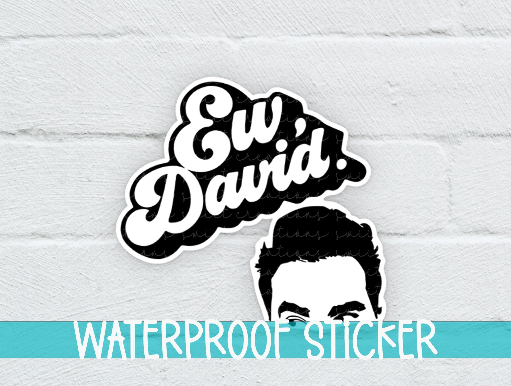 a white brick wall with a sticker of a man's face