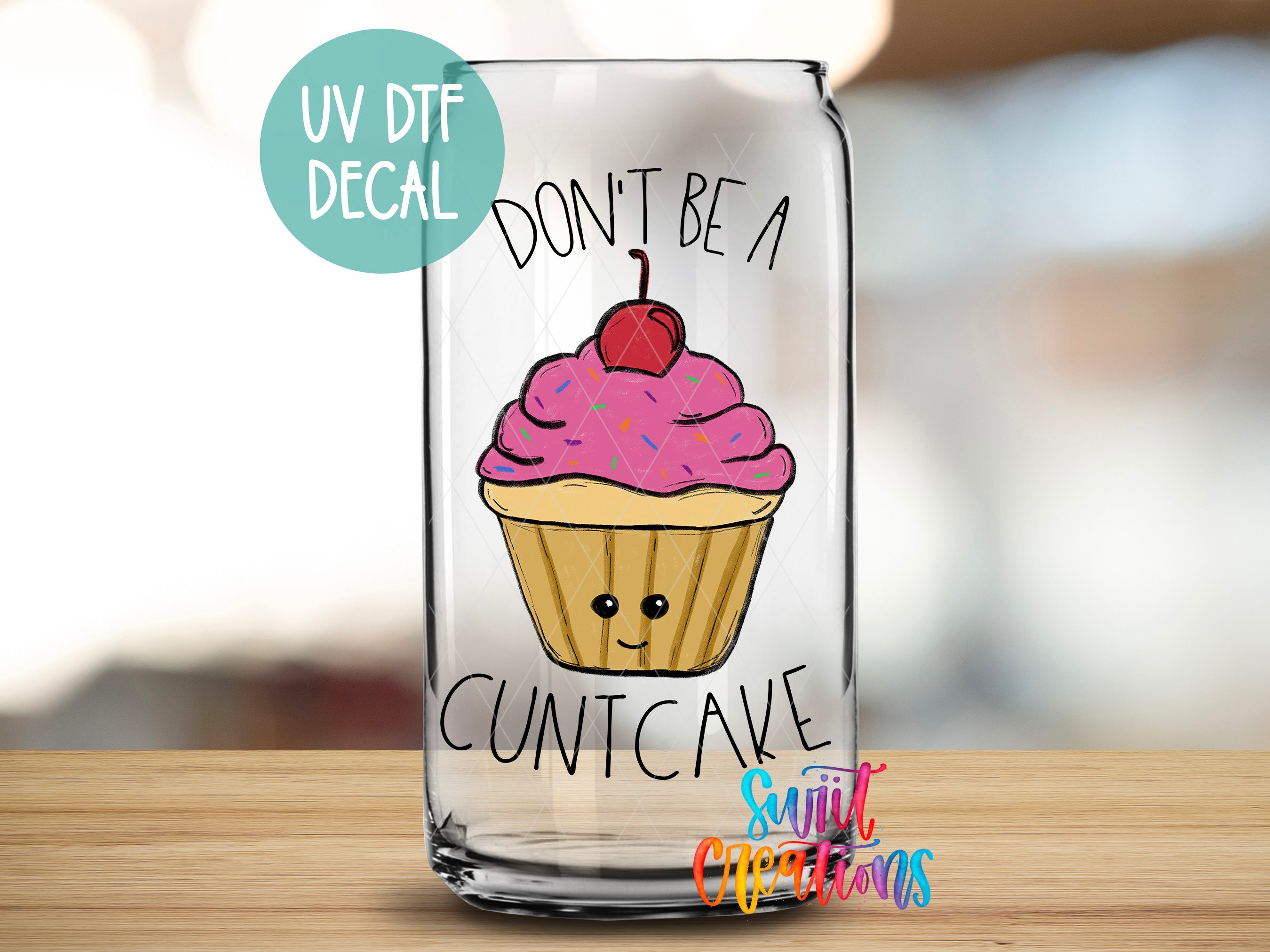 a glass with a picture of a cupcake on it