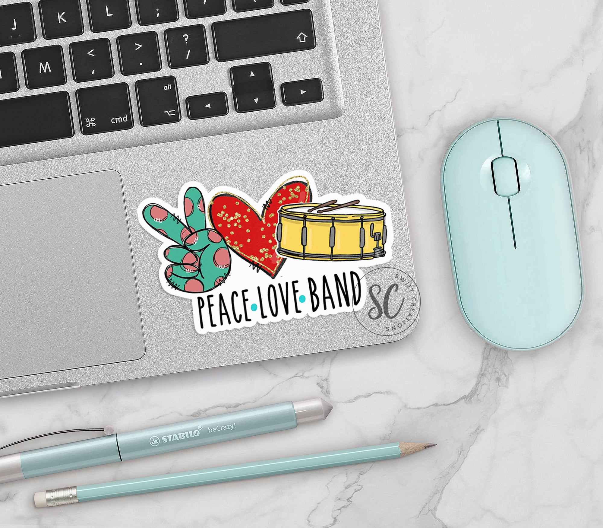 a laptop computer sitting next to a mouse and keyboard