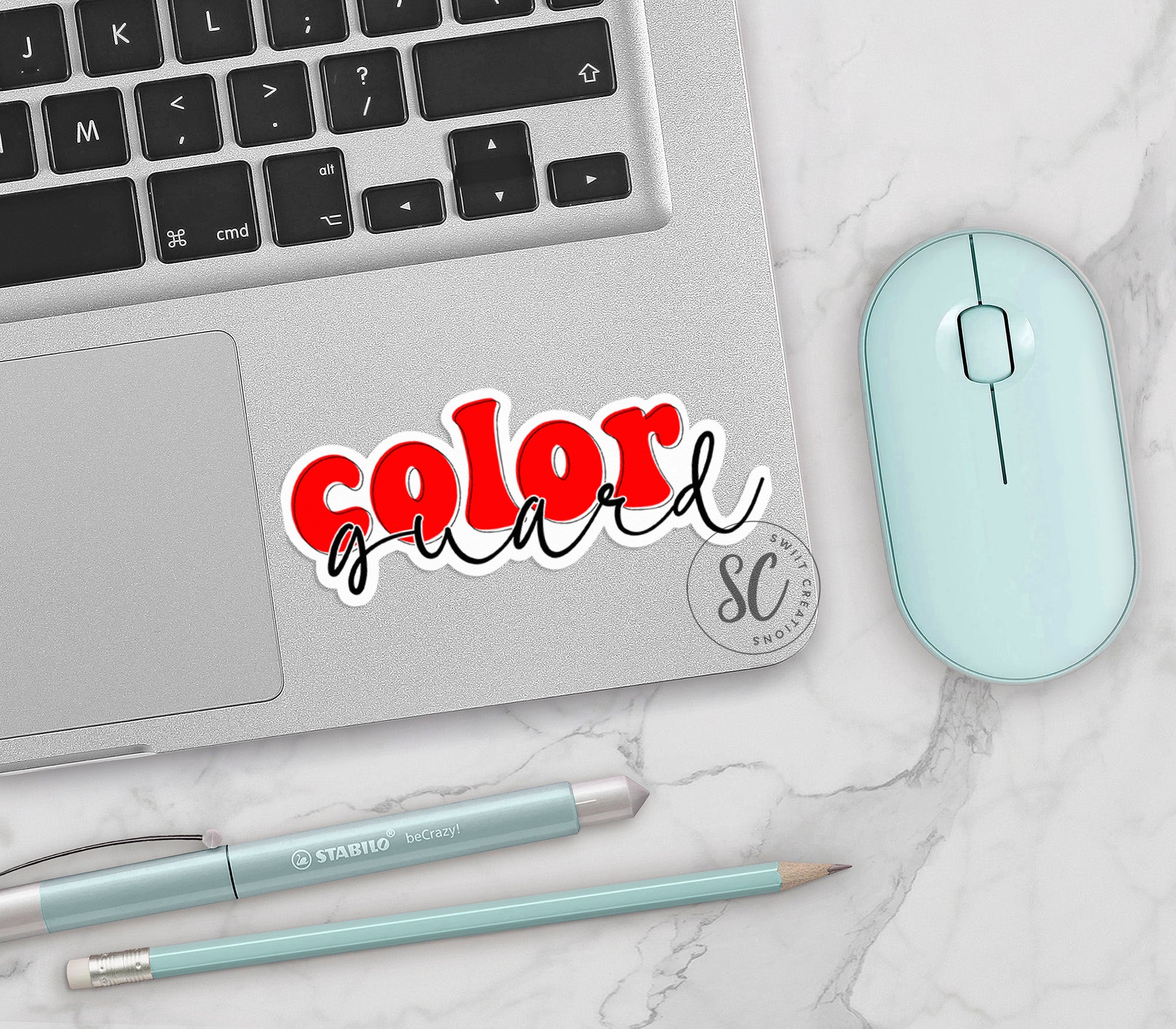 a laptop computer sitting on top of a white table