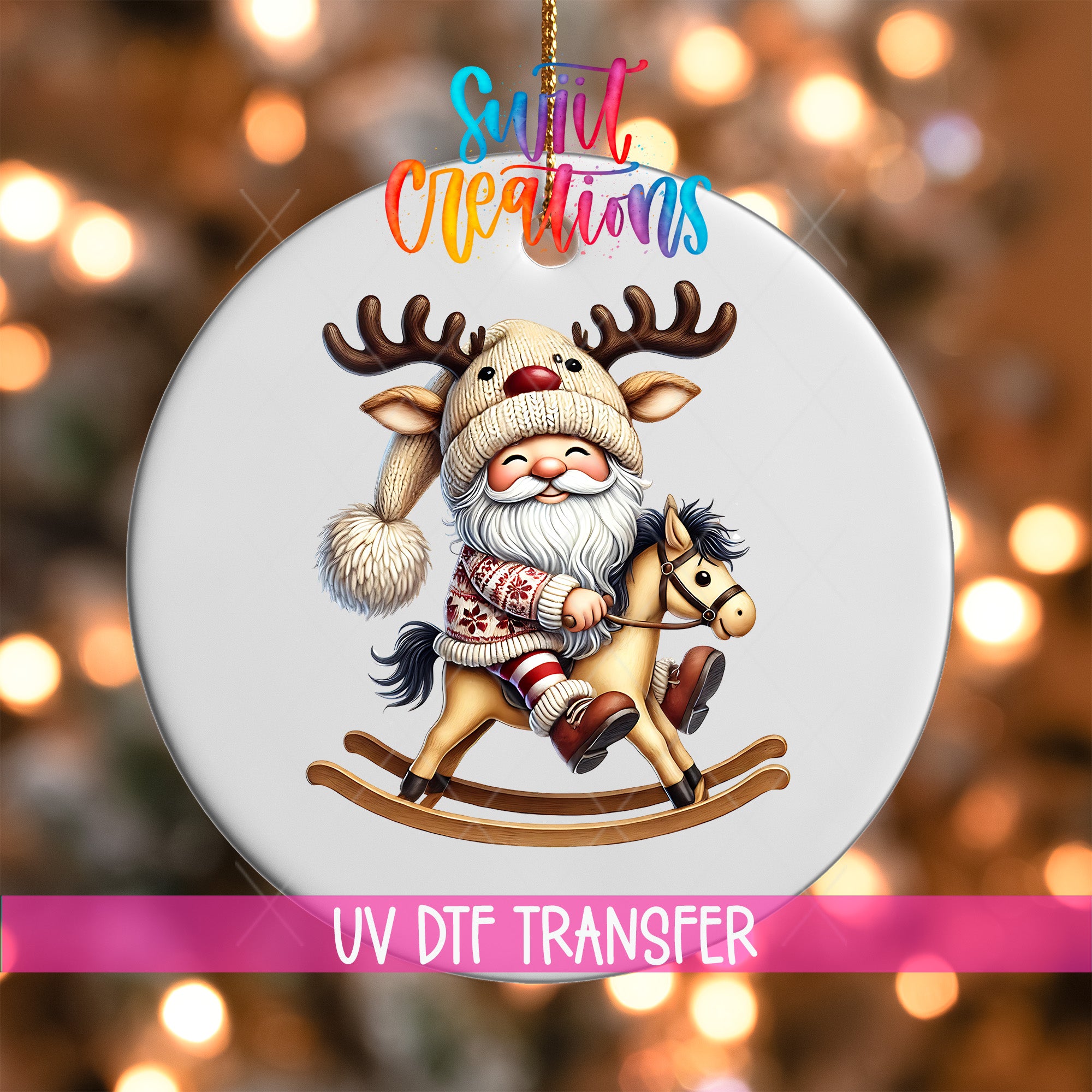 A white ornament with a cartoon reindeer and Santa Claus riding a rocking horse, with a colorful background and text indicating it is a UV DFT transfer.