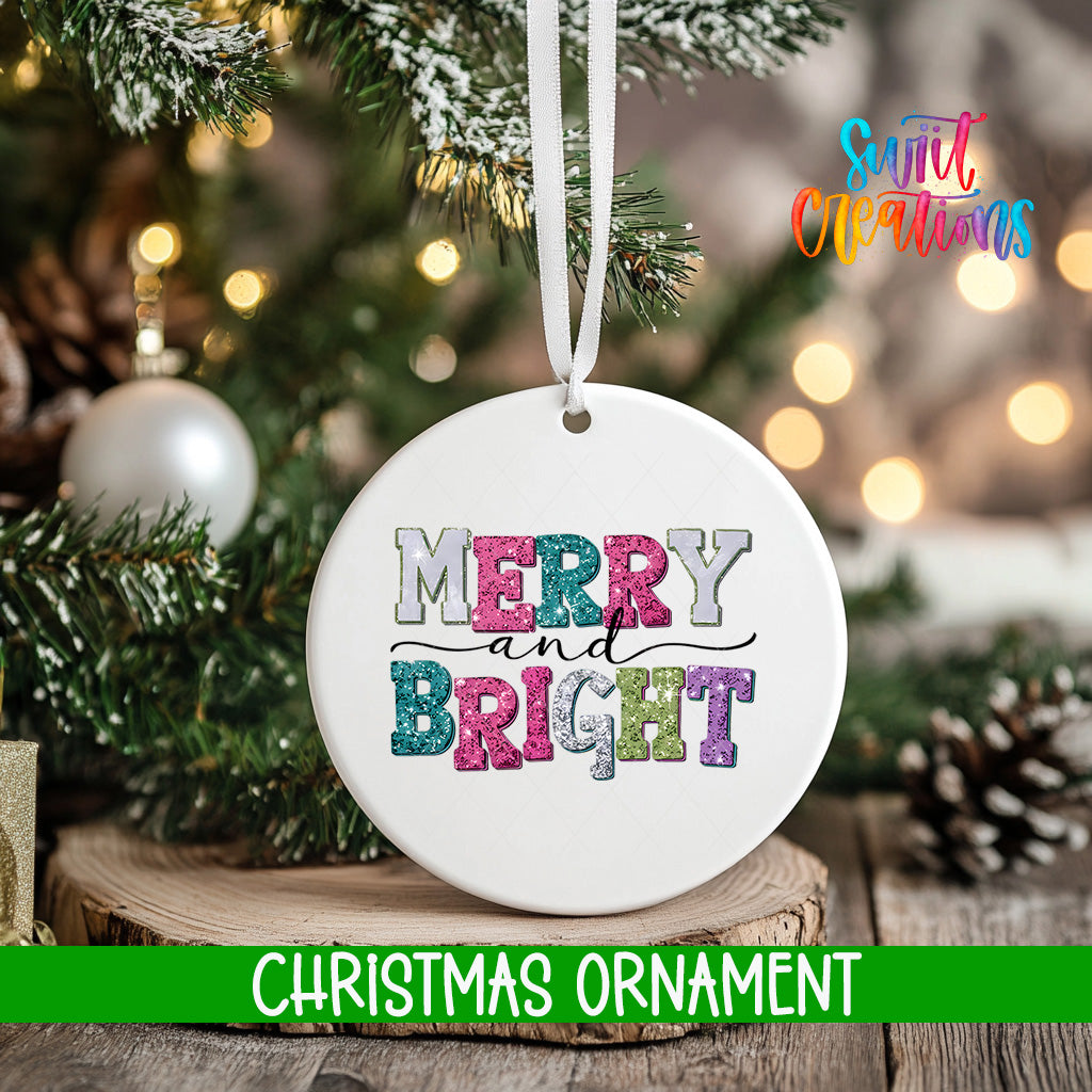 A white Christmas ornament with the text "MERRY AND BRIGHT" in colorful letters hangs from a tree branch.