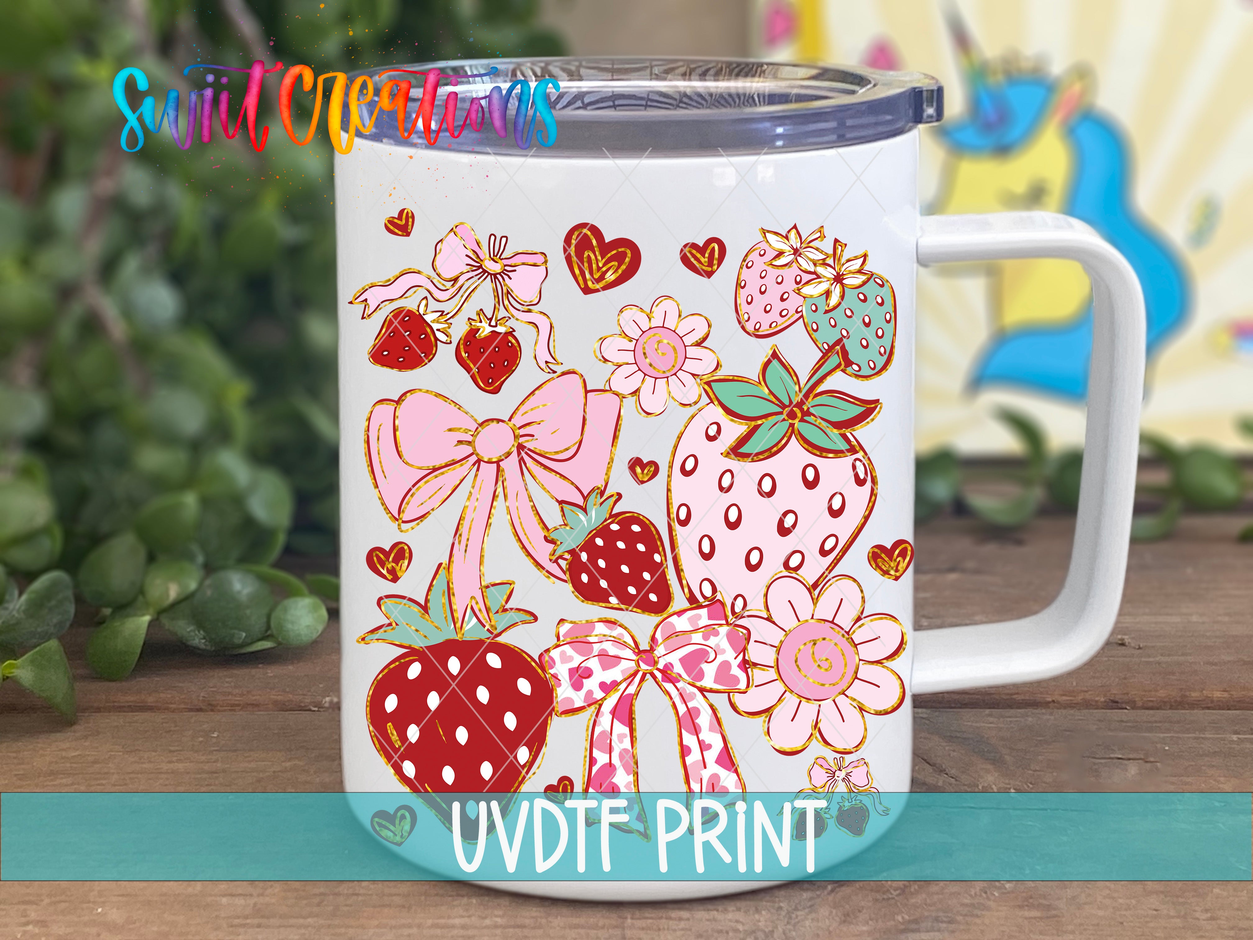 A white ceramic mug with a colorful and whimsical design featuring various fruits, flowers, and bows.