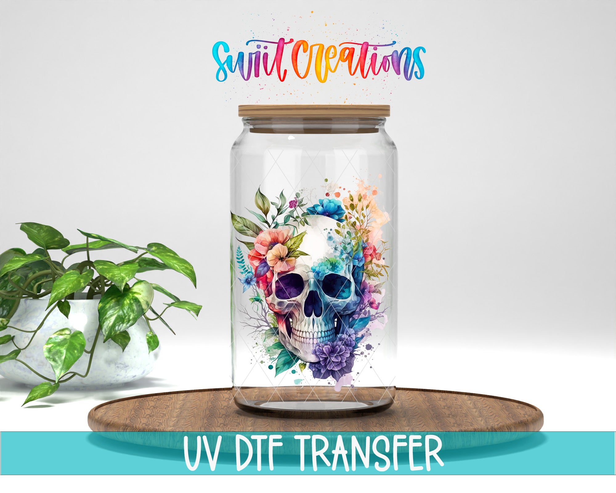 a glass jar with a colorful floral design on it, placed on a wooden surface. The jar is surrounded by a potted plant, and there is text at the bottom of the image that says "UV DFT TRANSFER".