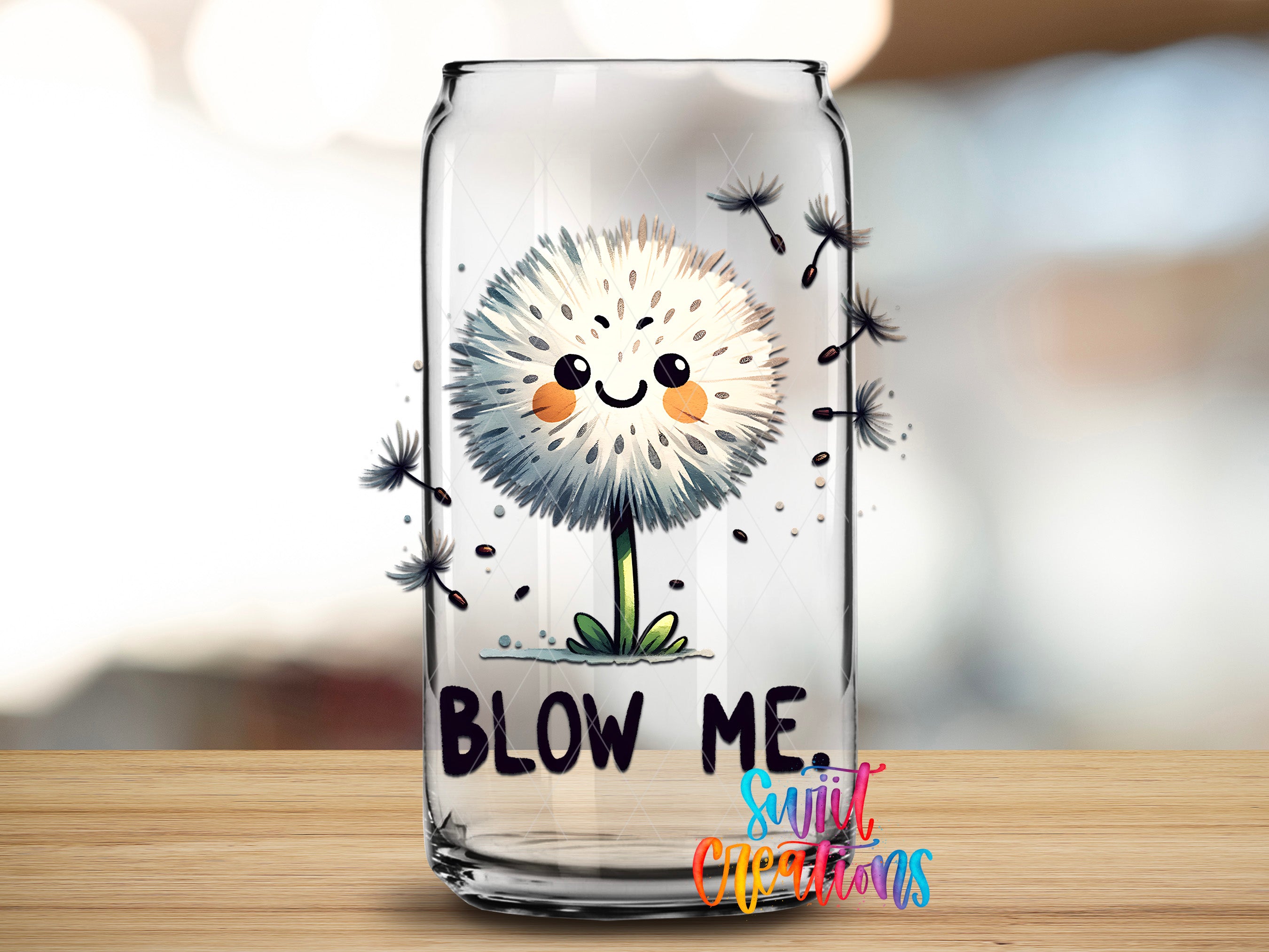 A glass can with a cartoon dandelion design and the text "BLOW ME" printed on it.