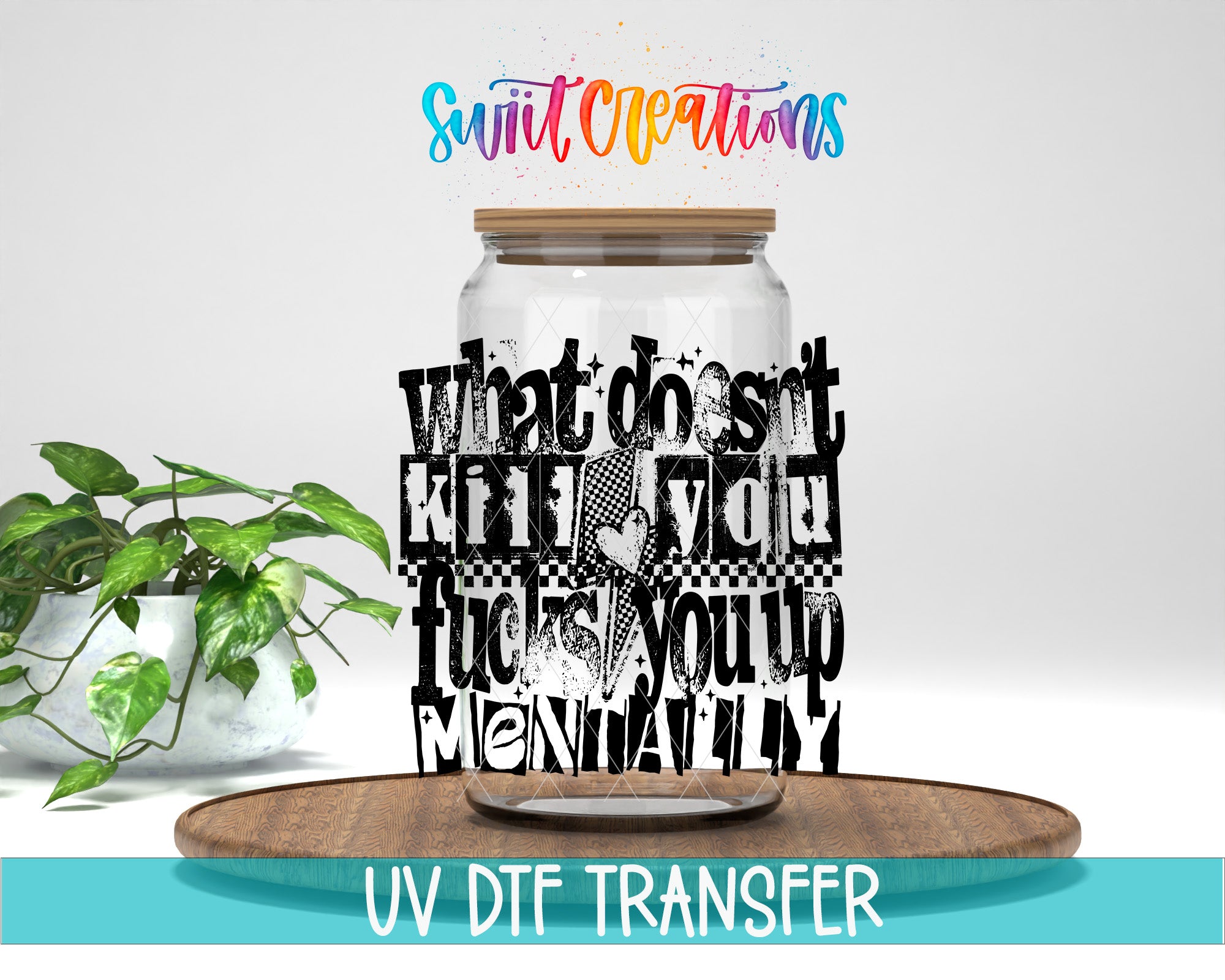 a large glass jar with a wooden lid, surrounded by a potted plant and a wooden tray. The jar has a message written on it in a stylized font, which appears to be a creative design or artwork.