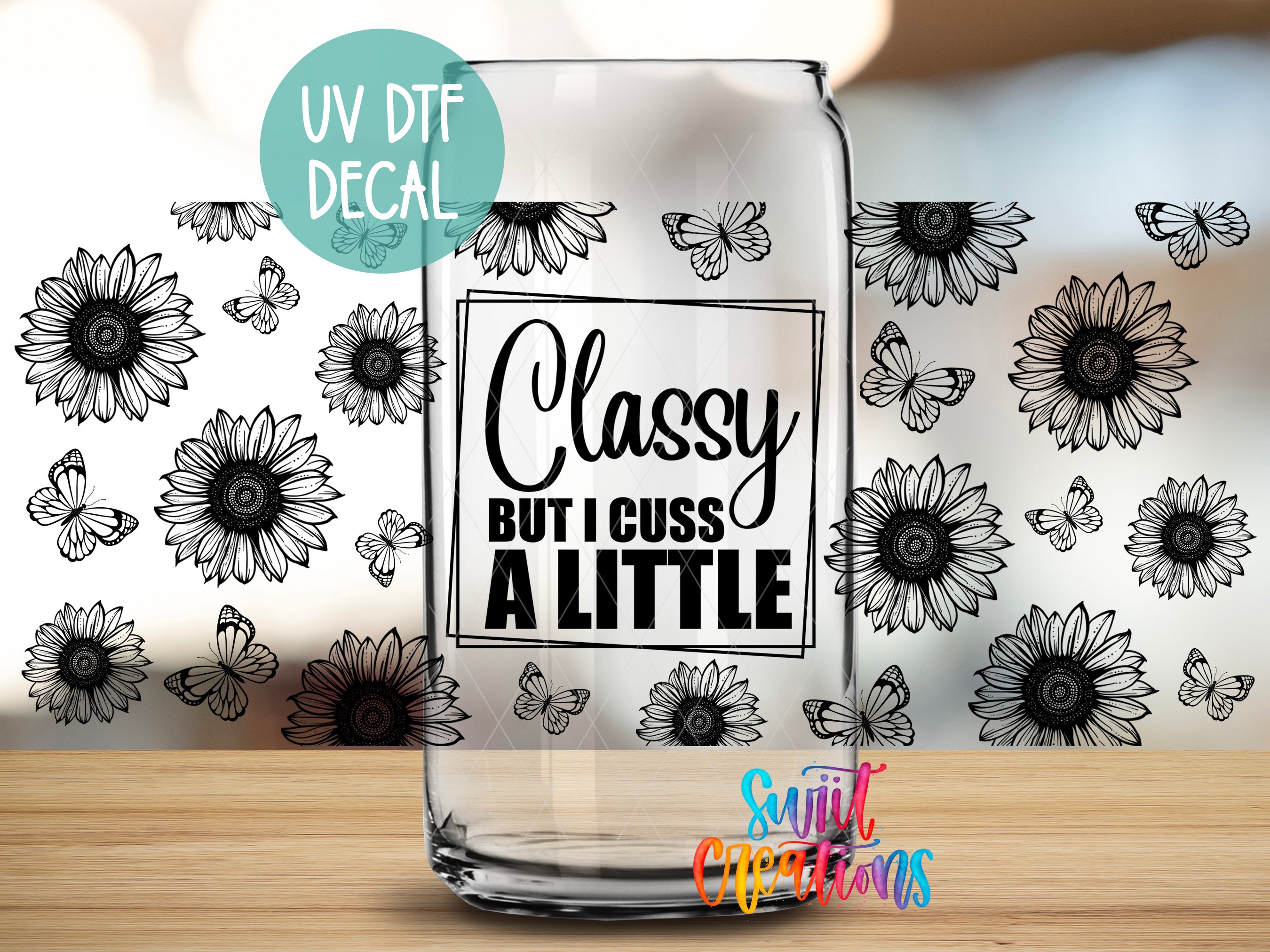 a glass can with a UV decal and a floral pattern on it.