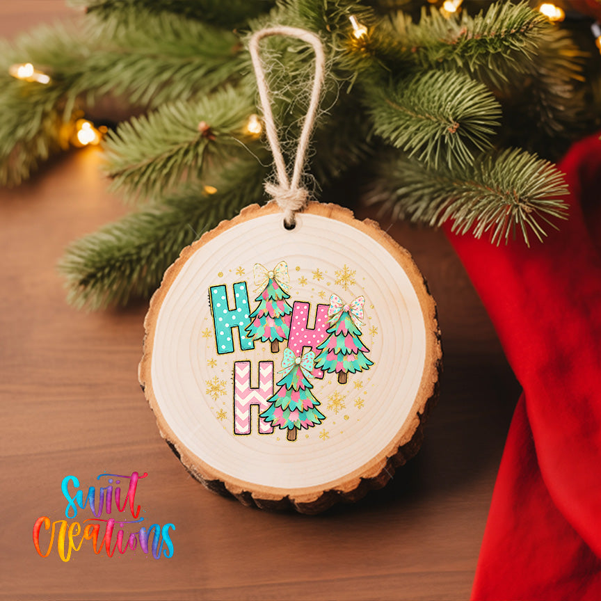A wooden ornament with the word "HAPPY" written on it, hanging on a Christmas tree.