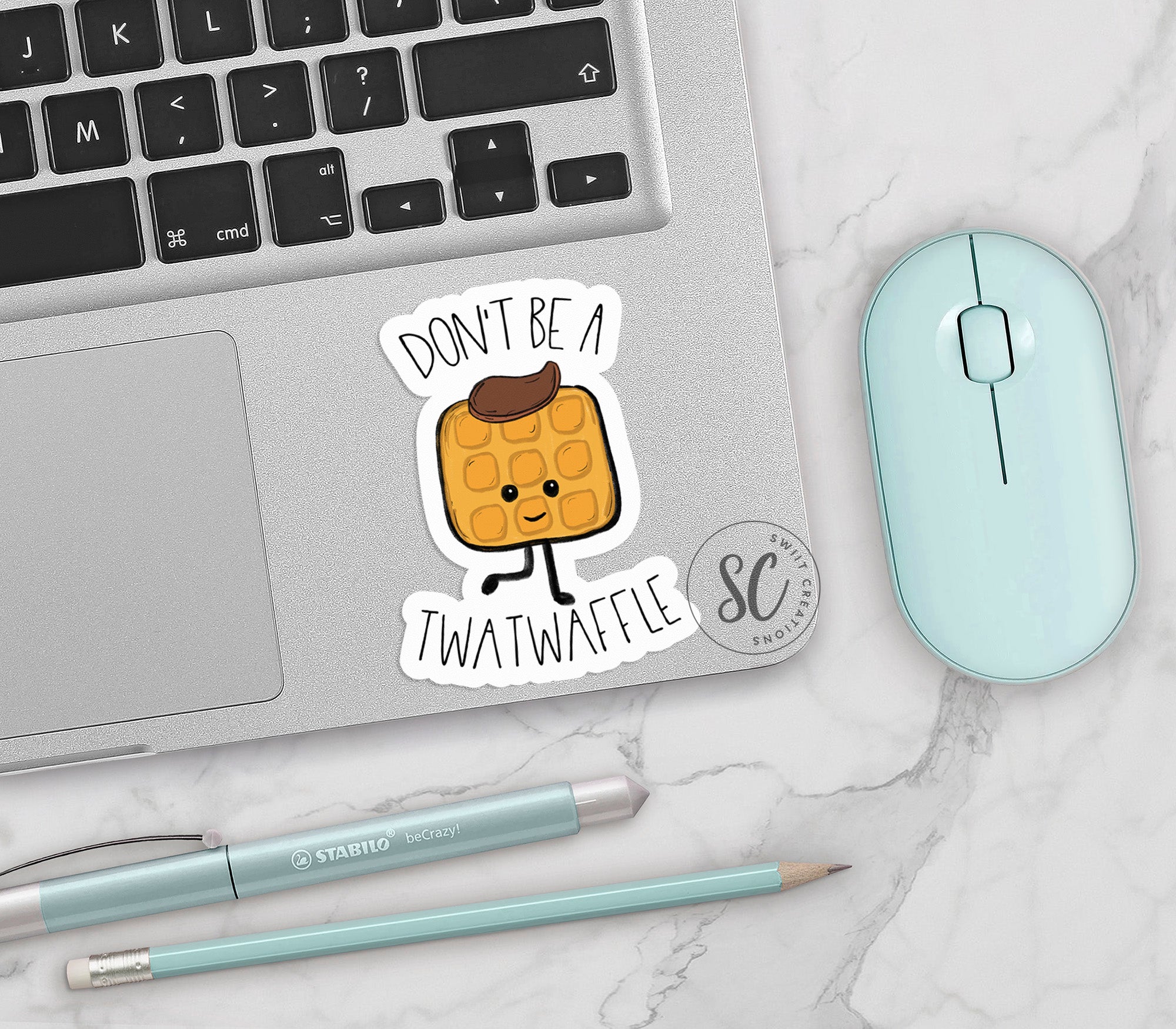 a laptop with a sticker of a peanut butter sandwich