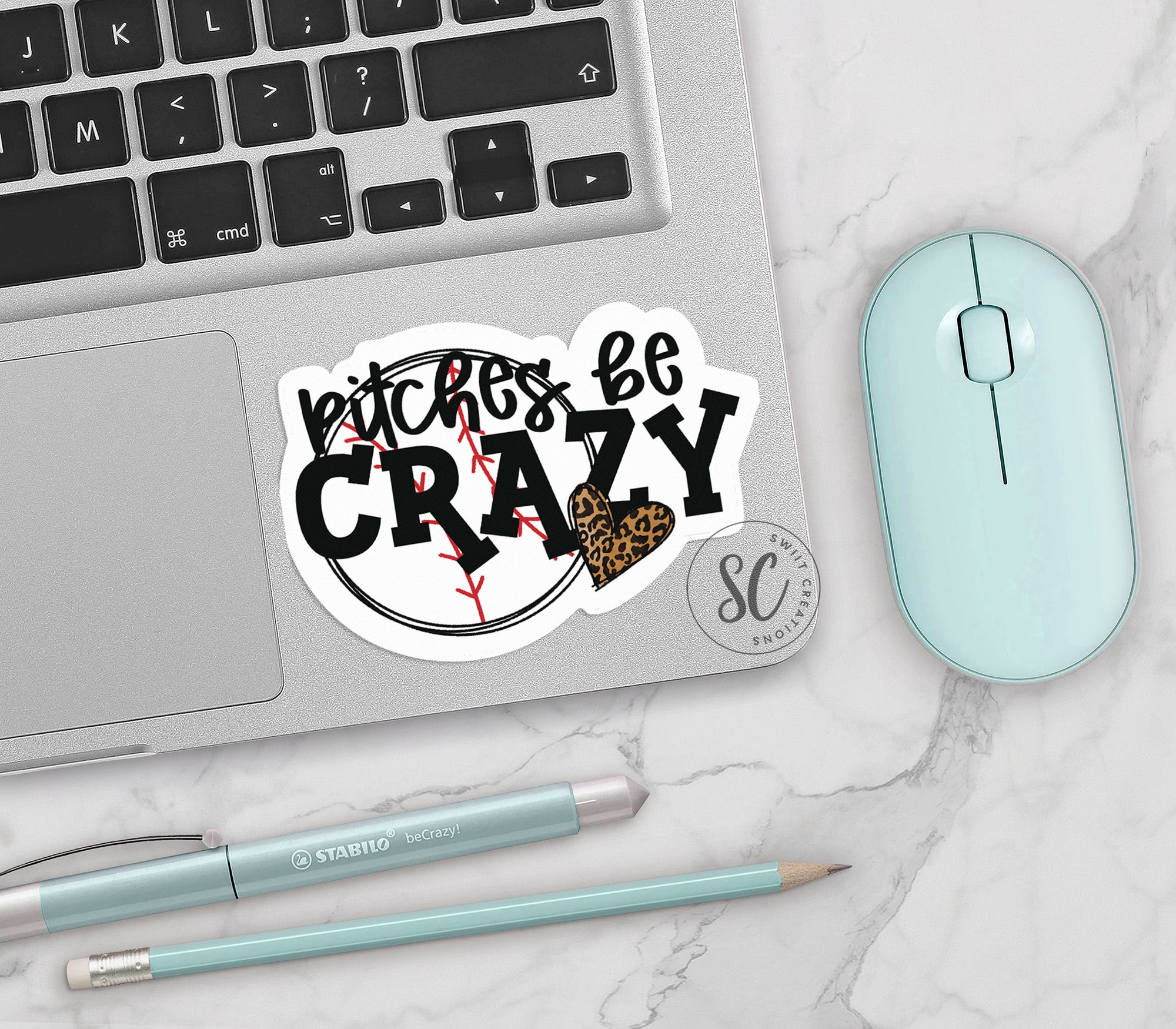 a laptop computer sitting on top of a white table