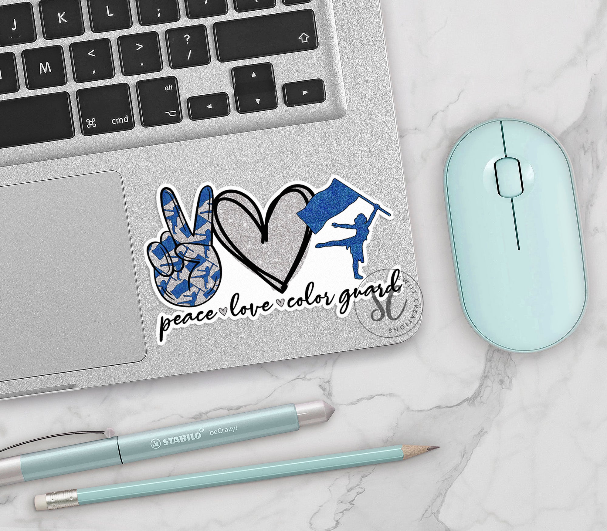 a laptop with a sticker of a hand and a heart