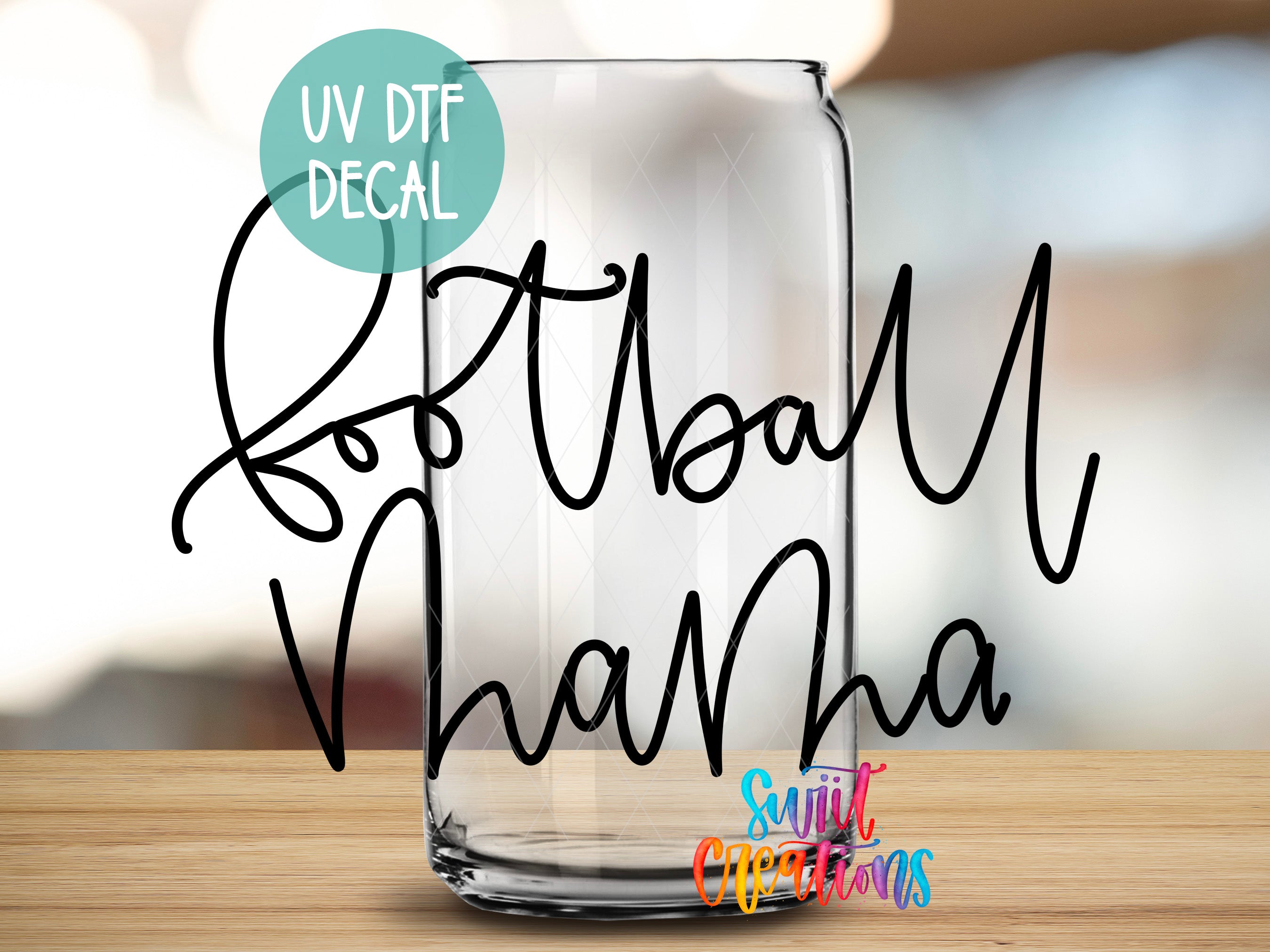 a glass with a name on it sitting on a table