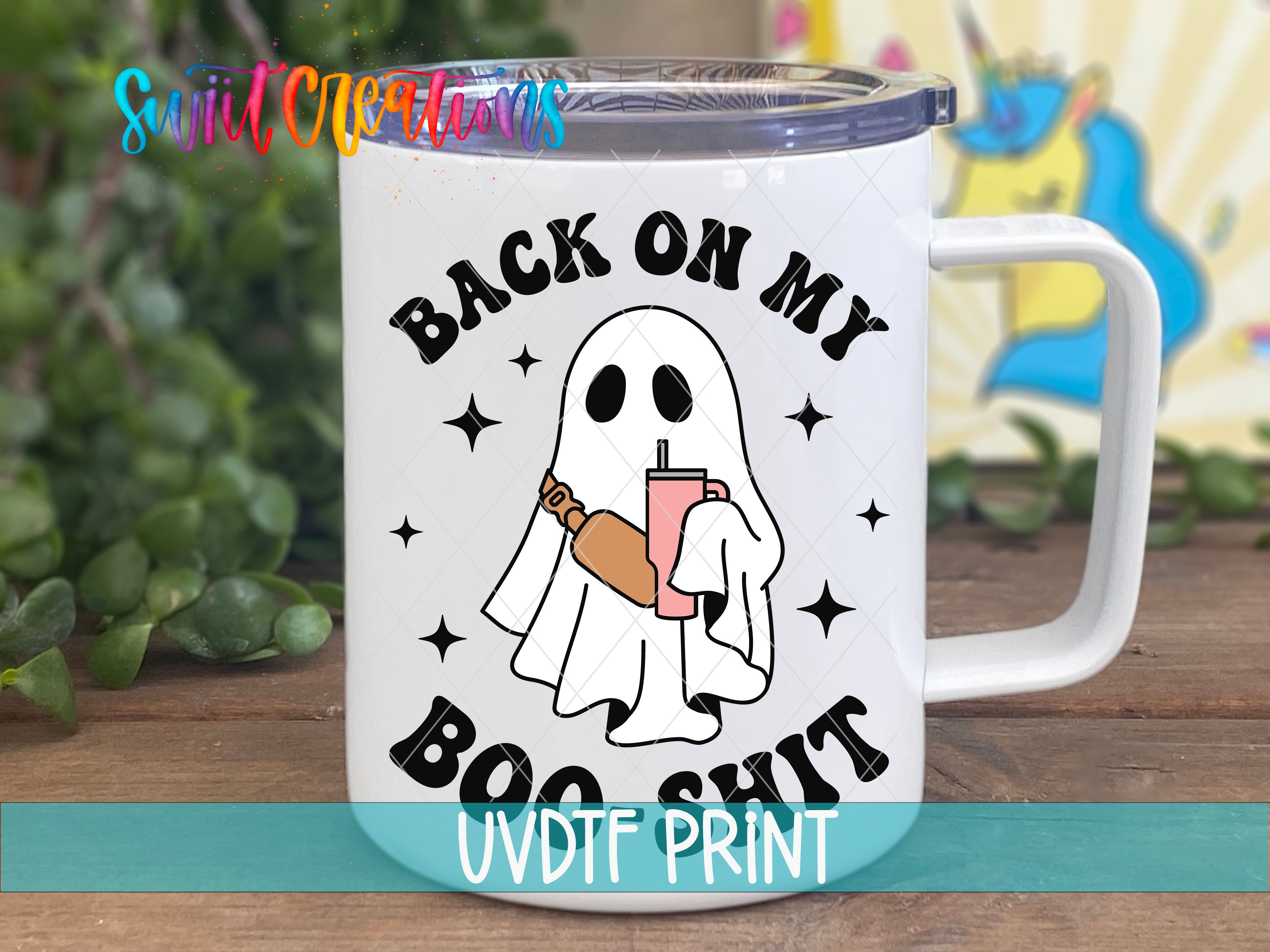 A white mug with a graphic design featuring a ghost holding a drink and the text "BACK ON MY BOO SHIT" printed on it.