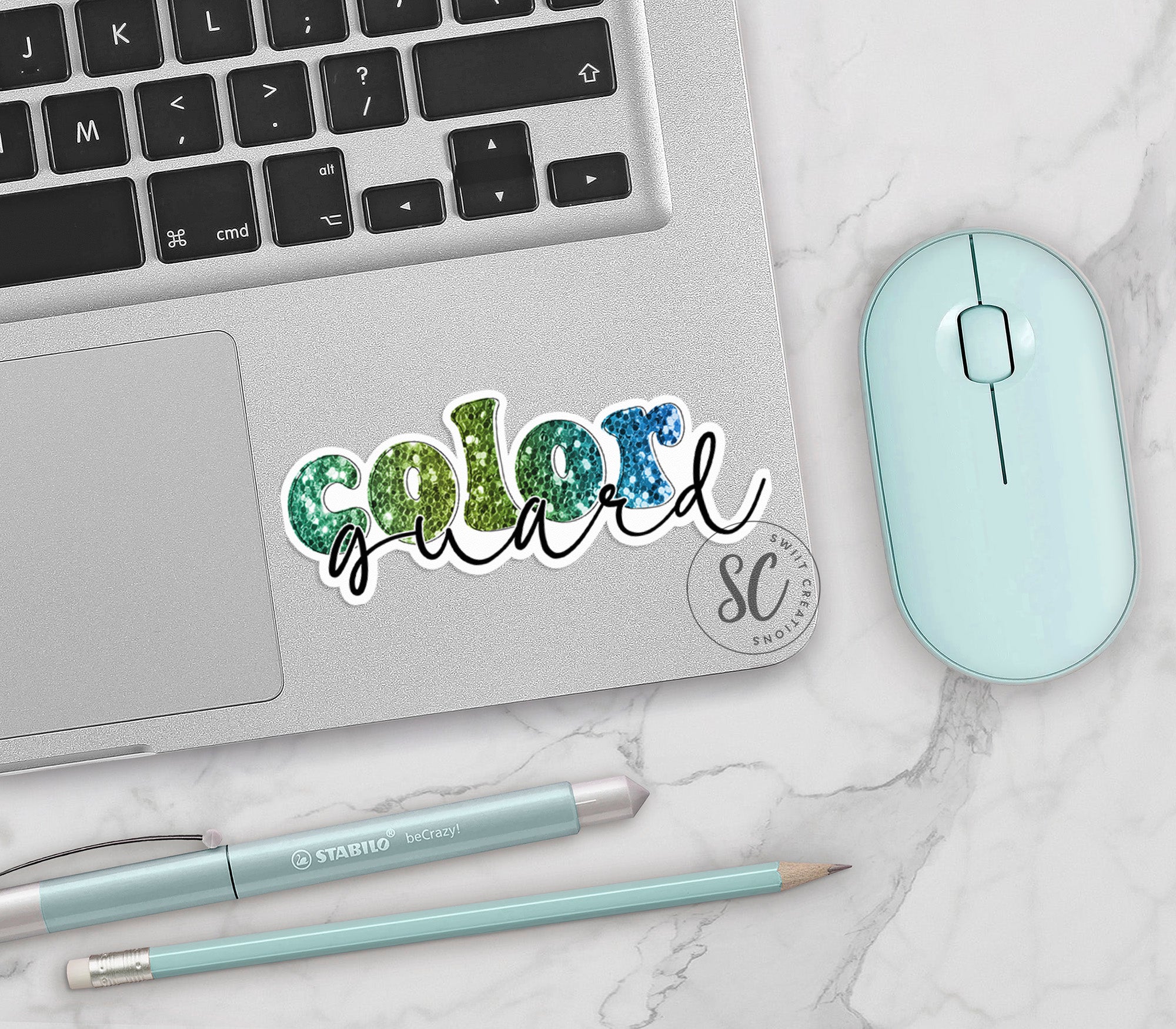 a laptop computer sitting next to a mouse and keyboard