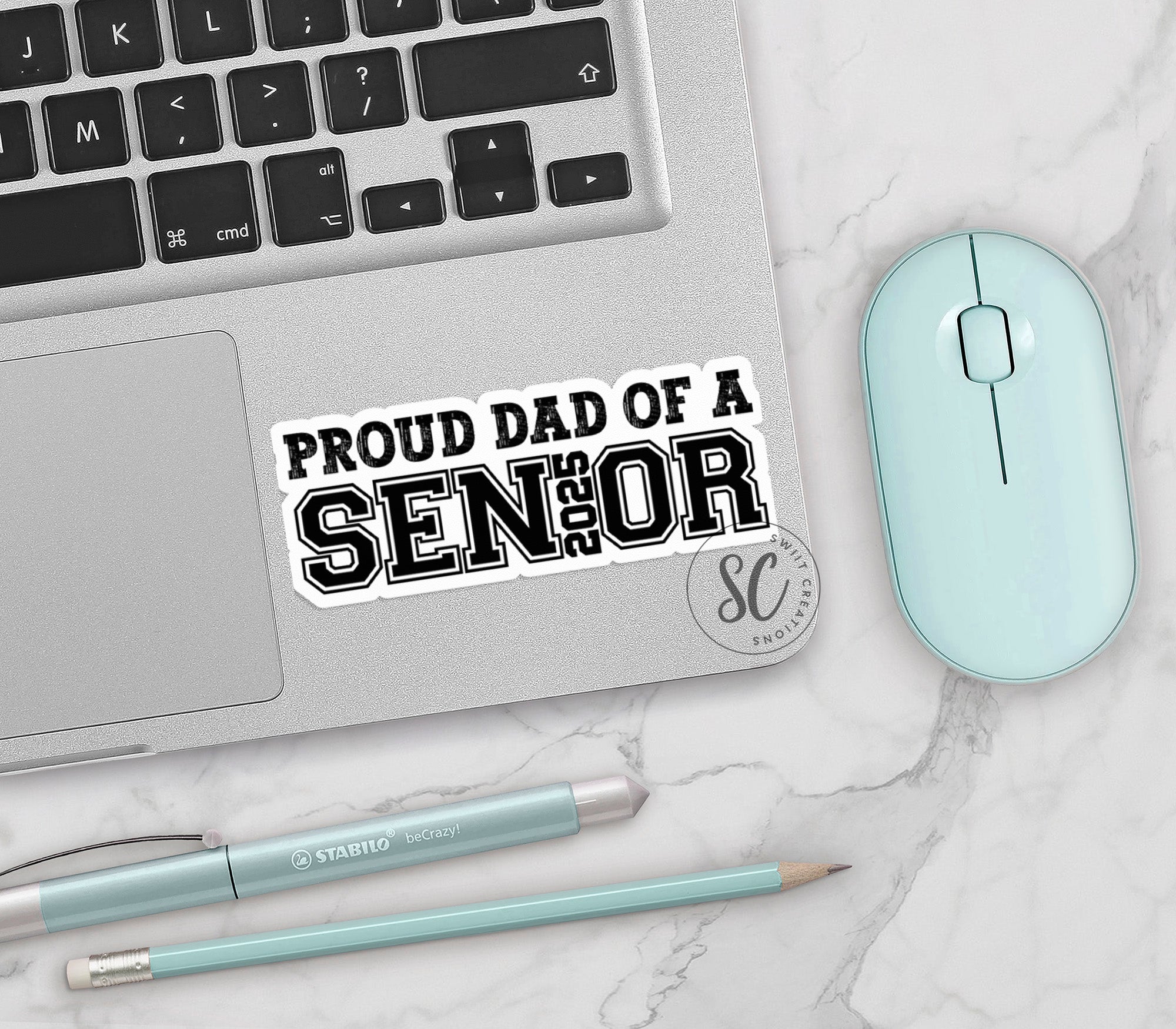 a sticker that says proud dad of a senior