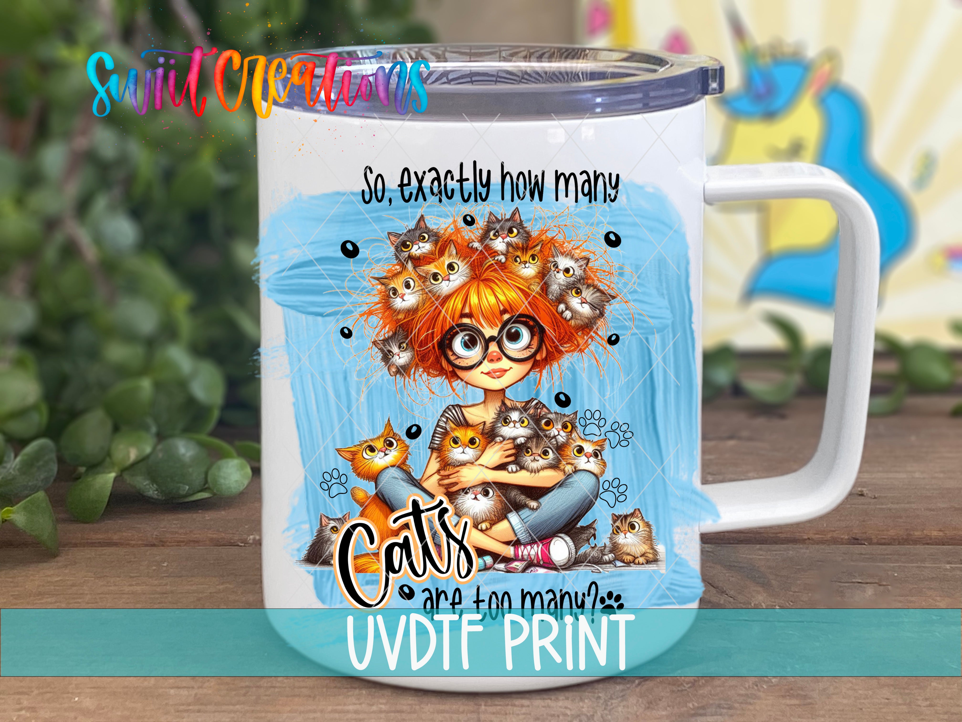A white mug with a colorful illustration of a girl surrounded by cats.