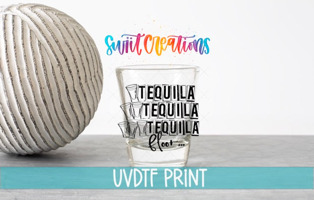 a shot glass with the text "TEQUILA TEQUILA TEQUILA" printed on it, along with a large ball and a colorful text logo in the background.