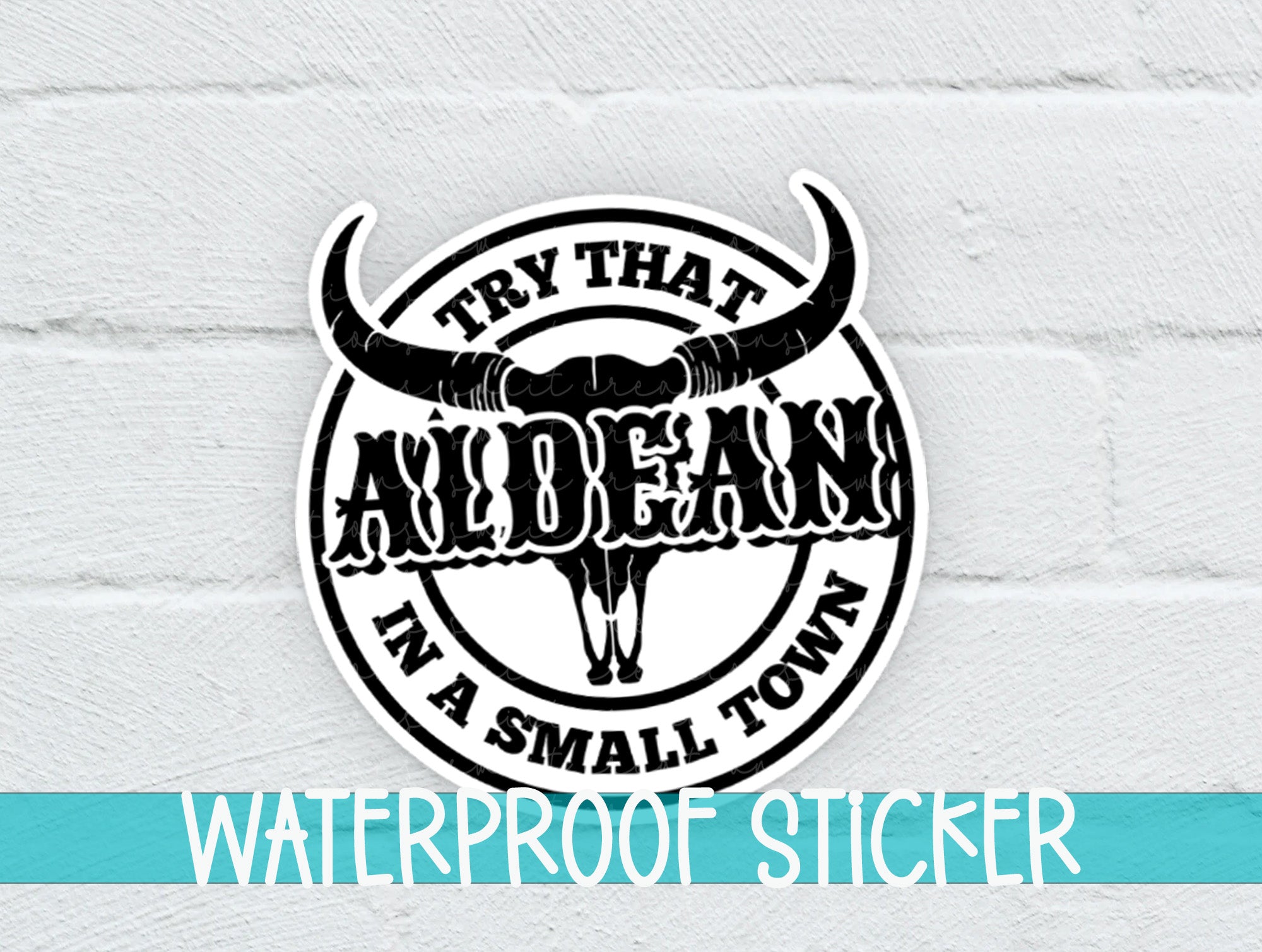 a white brick wall with a black and white sticker on it