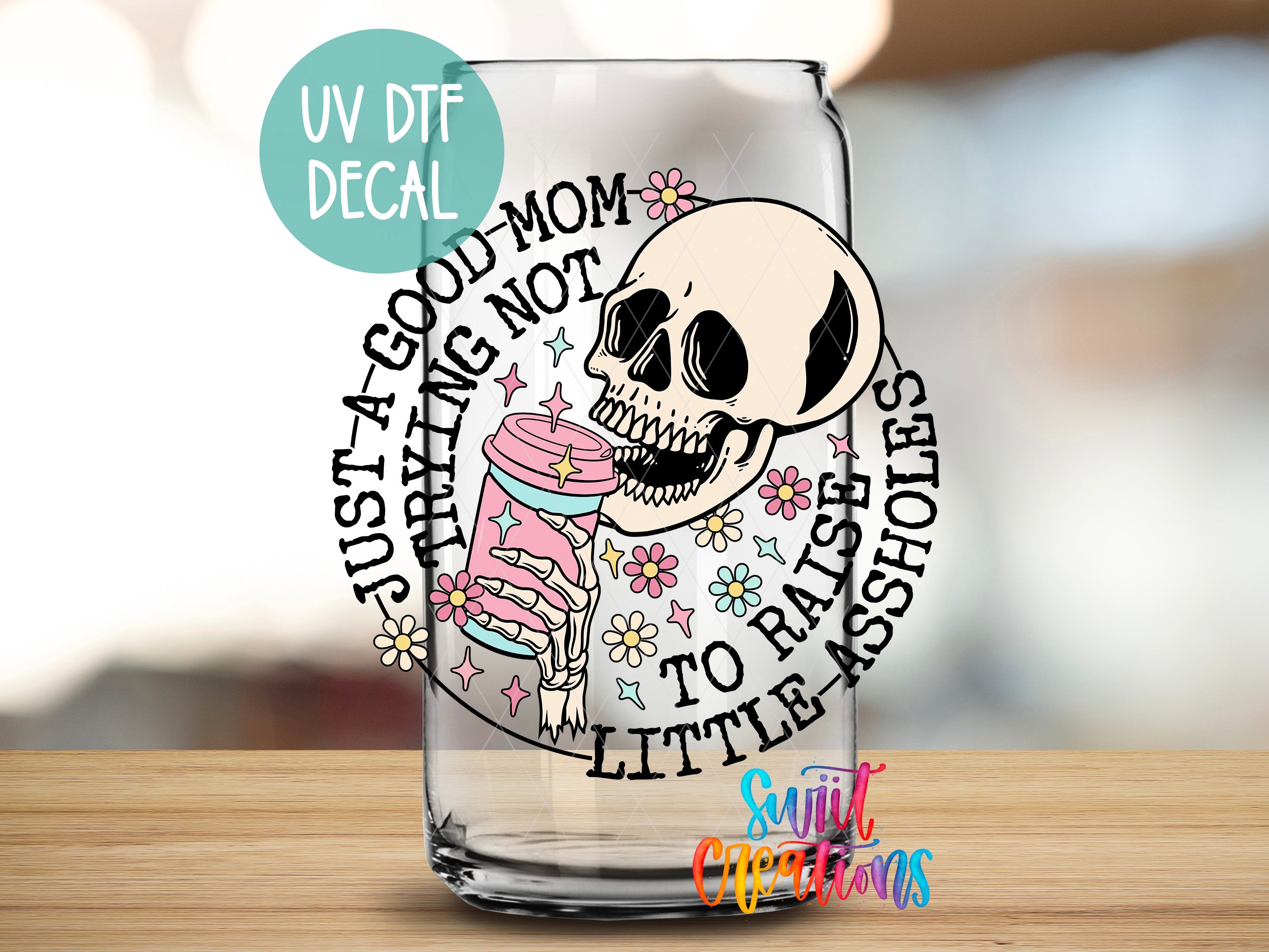 a glass with a skull and a cupcake on it