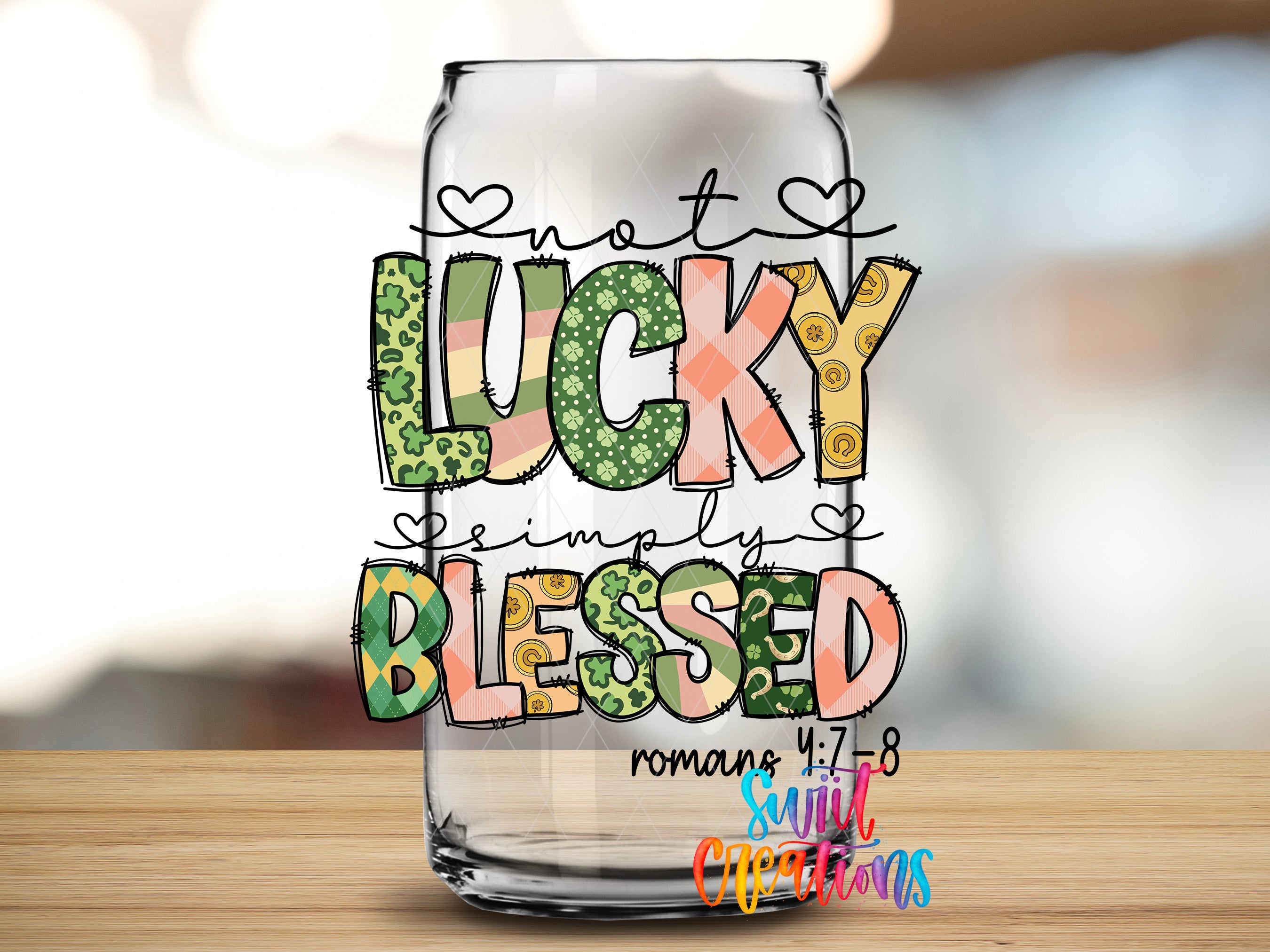 a glass jar with a colorful, hand-drawn design that says "not LUCKY simply BLEEDED" and includes a Bible verse reference.