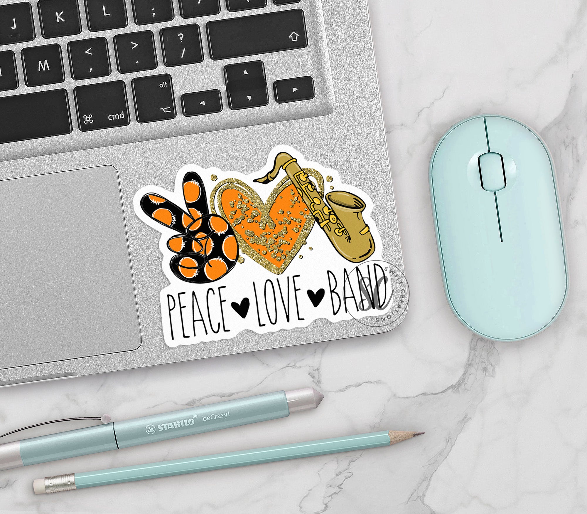 a laptop computer sitting next to a mouse and keyboard