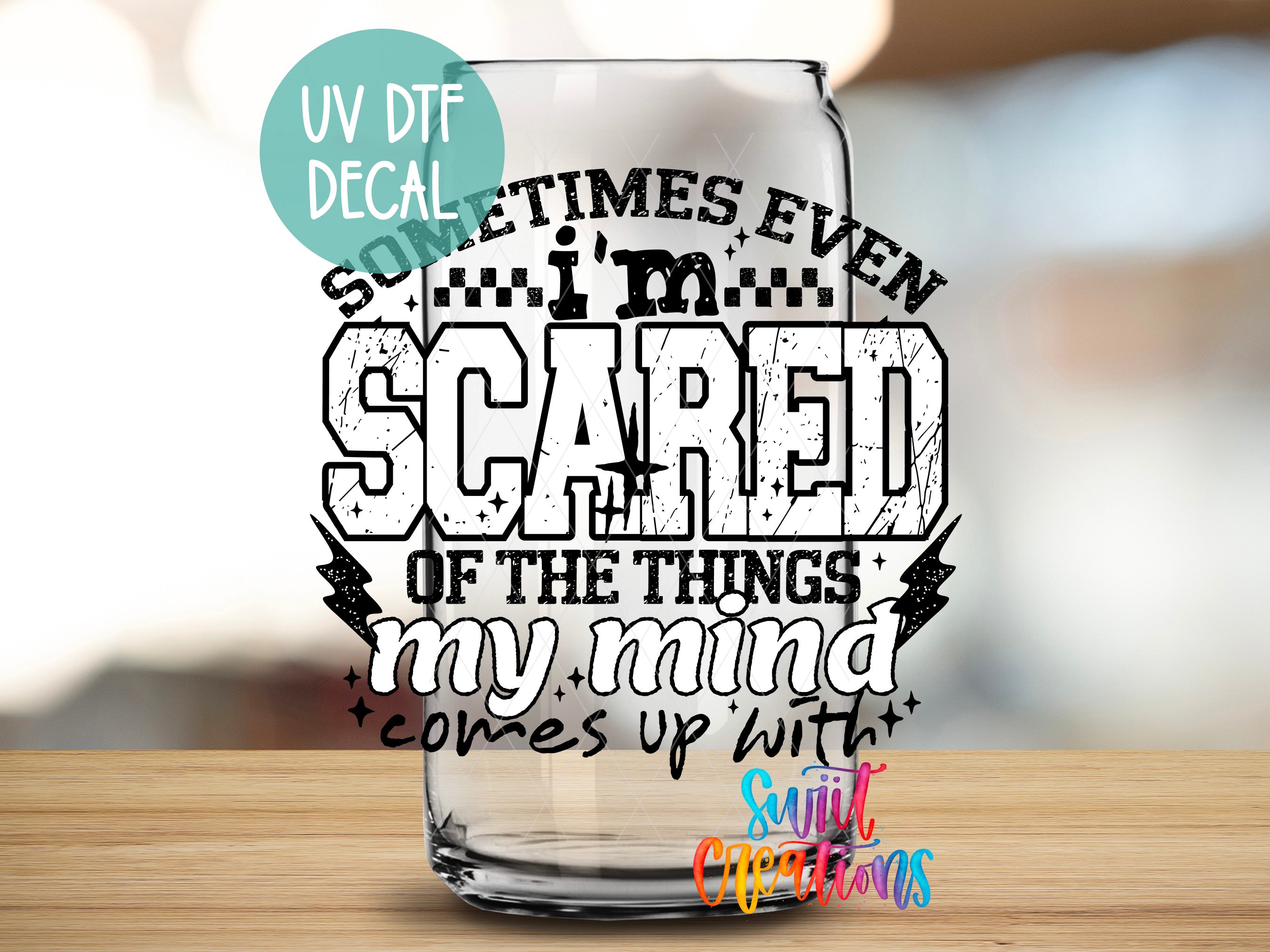 a glass with a text decal on it, which reads "Sometimes, even scared of the things my mind comes up with".