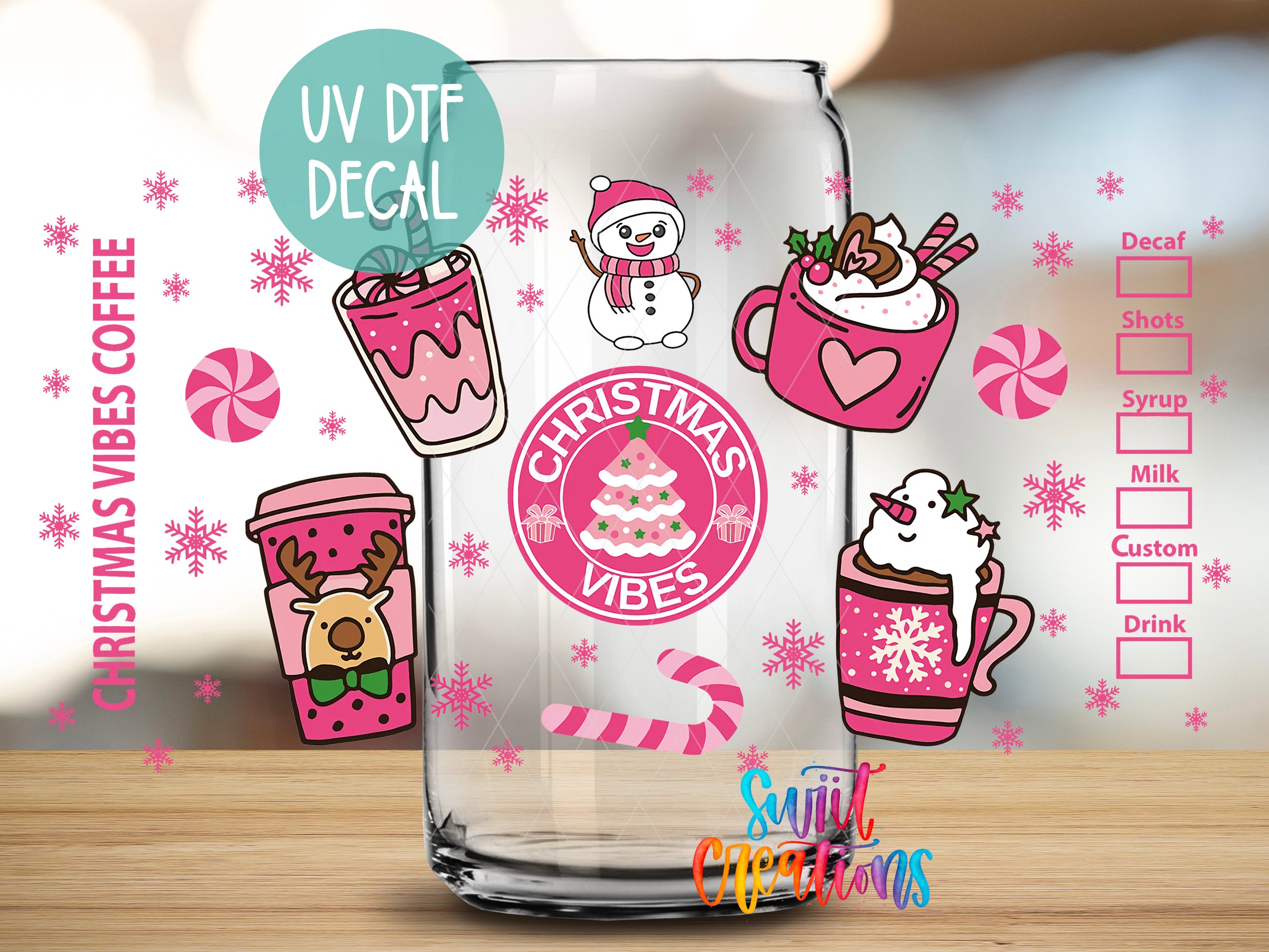 a glass with various Christmas-themed decals and illustrations, including a snowman, a cup of hot chocolate, a mug of whipped cream, and a snowman. The glass is set against a background with pink and white snowflakes and other festive decorations.