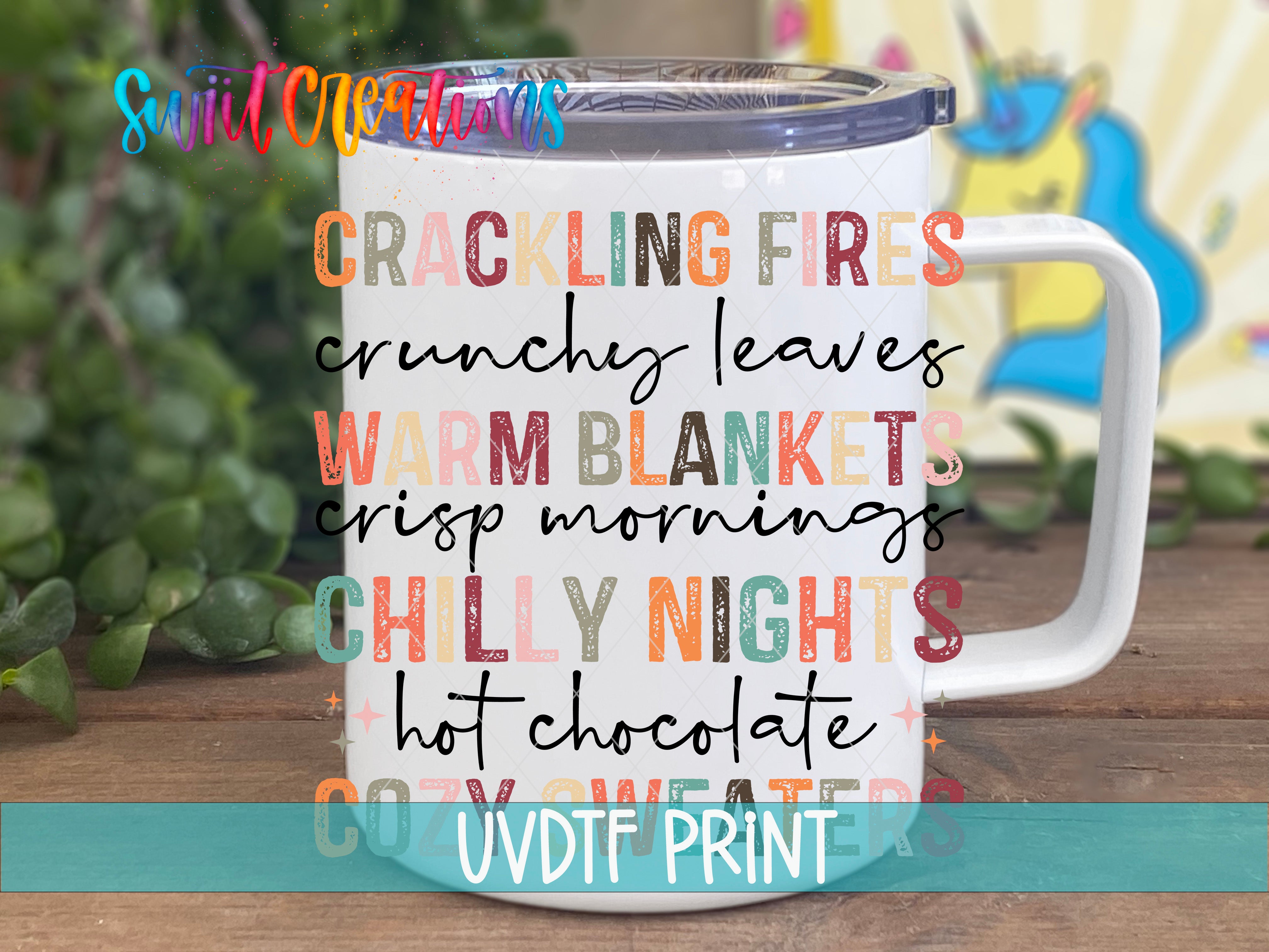 A white mug with text printed on it, placed on a wooden surface with a blurred background.