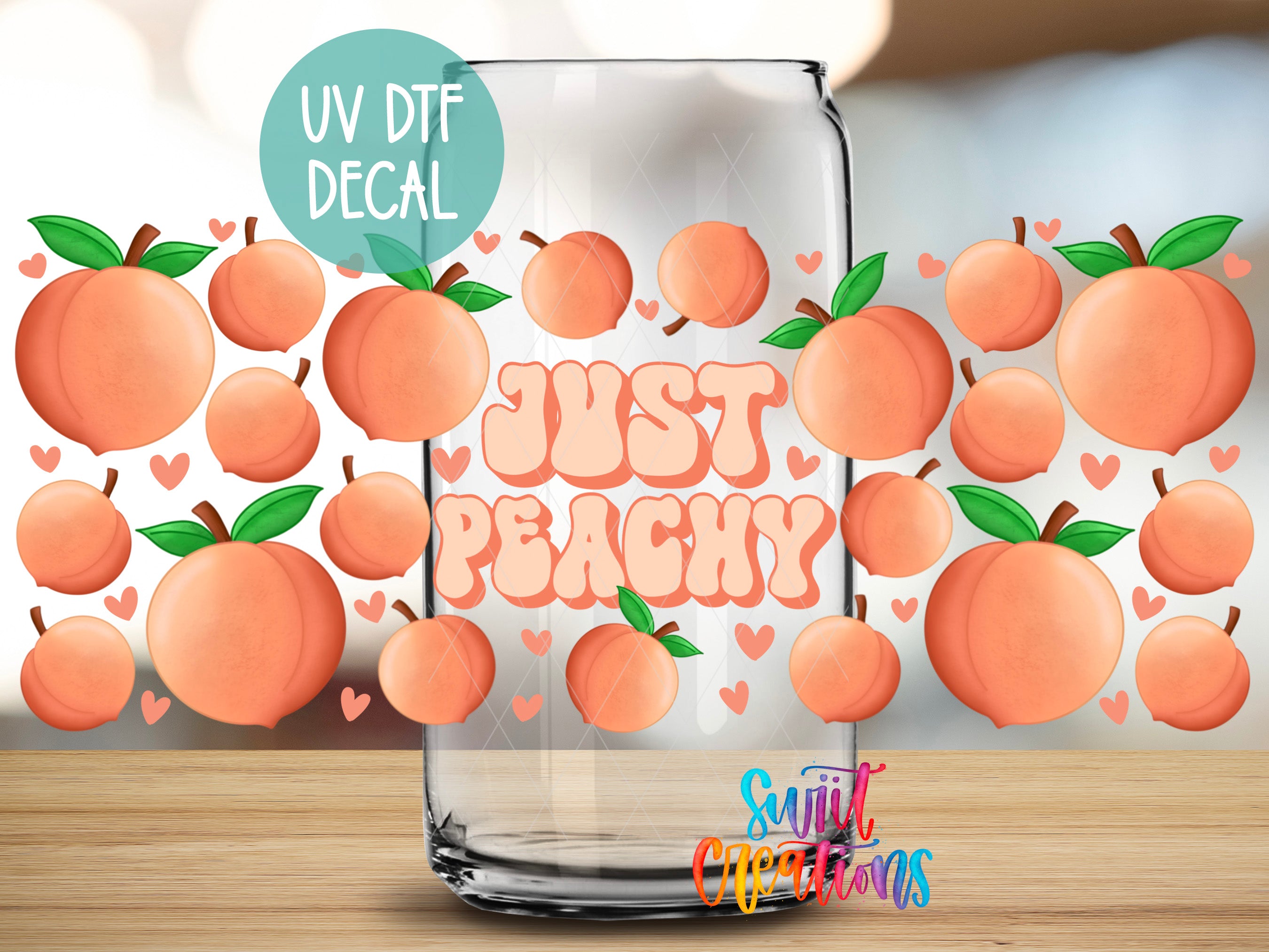 a glass jar with a design of peaches and the text "Just Peachy" on it.