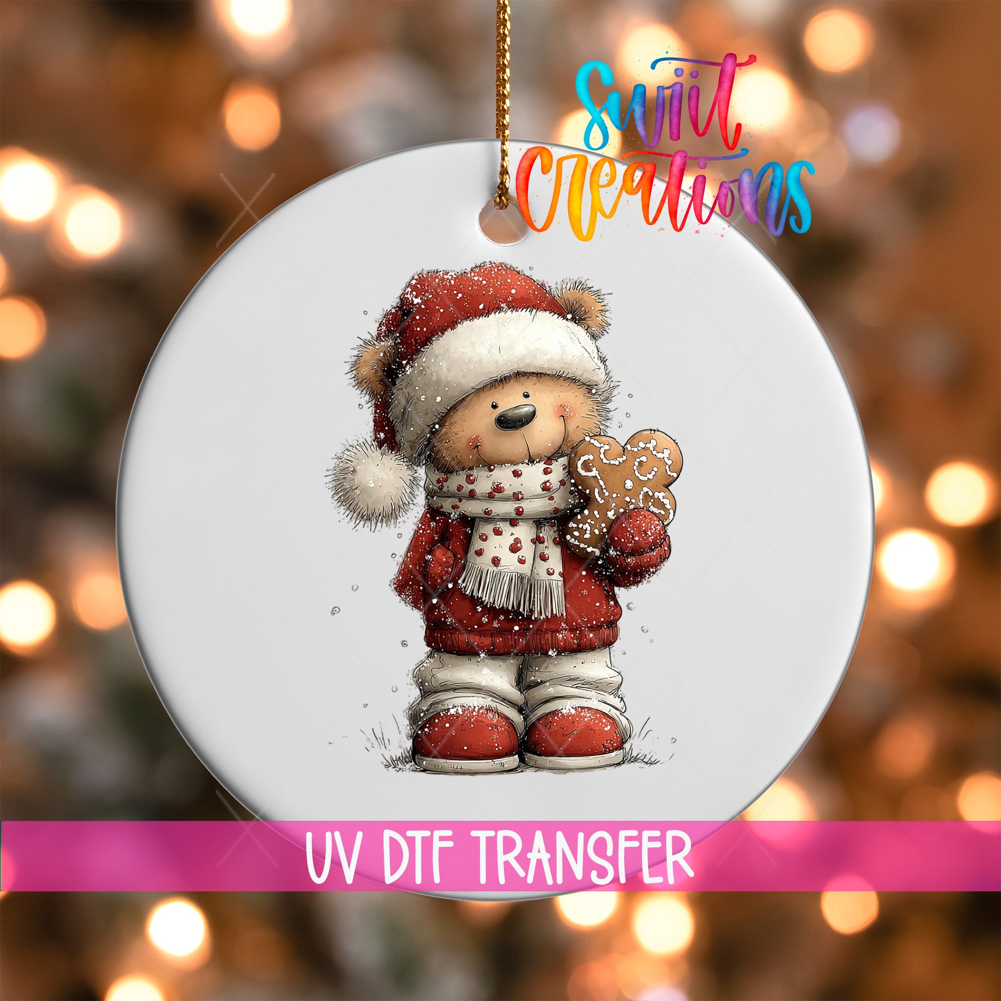 A white ornament featuring a teddy bear wearing a Santa hat and holding a gingerbread man, with a colorful background of Christmas lights.