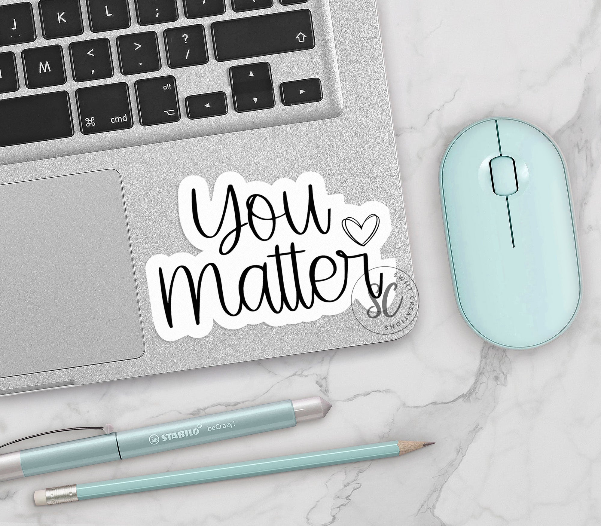 a laptop with a sticker that says you matter