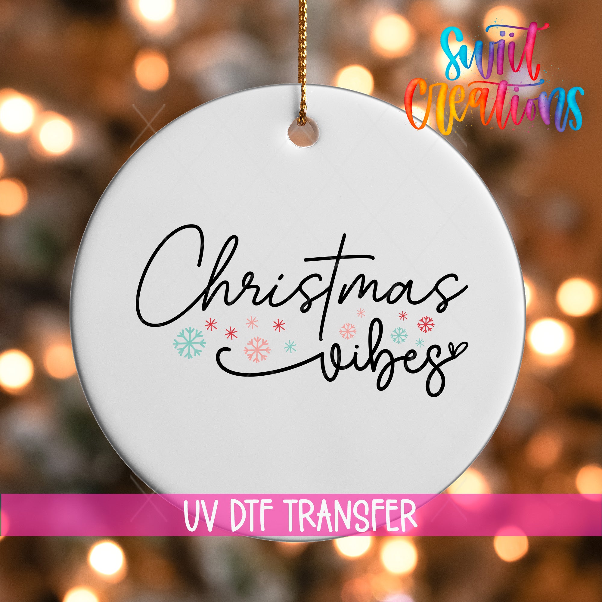 A white ornament with the text "Christmas vibes" written on it, hanging against a background of colorful lights.