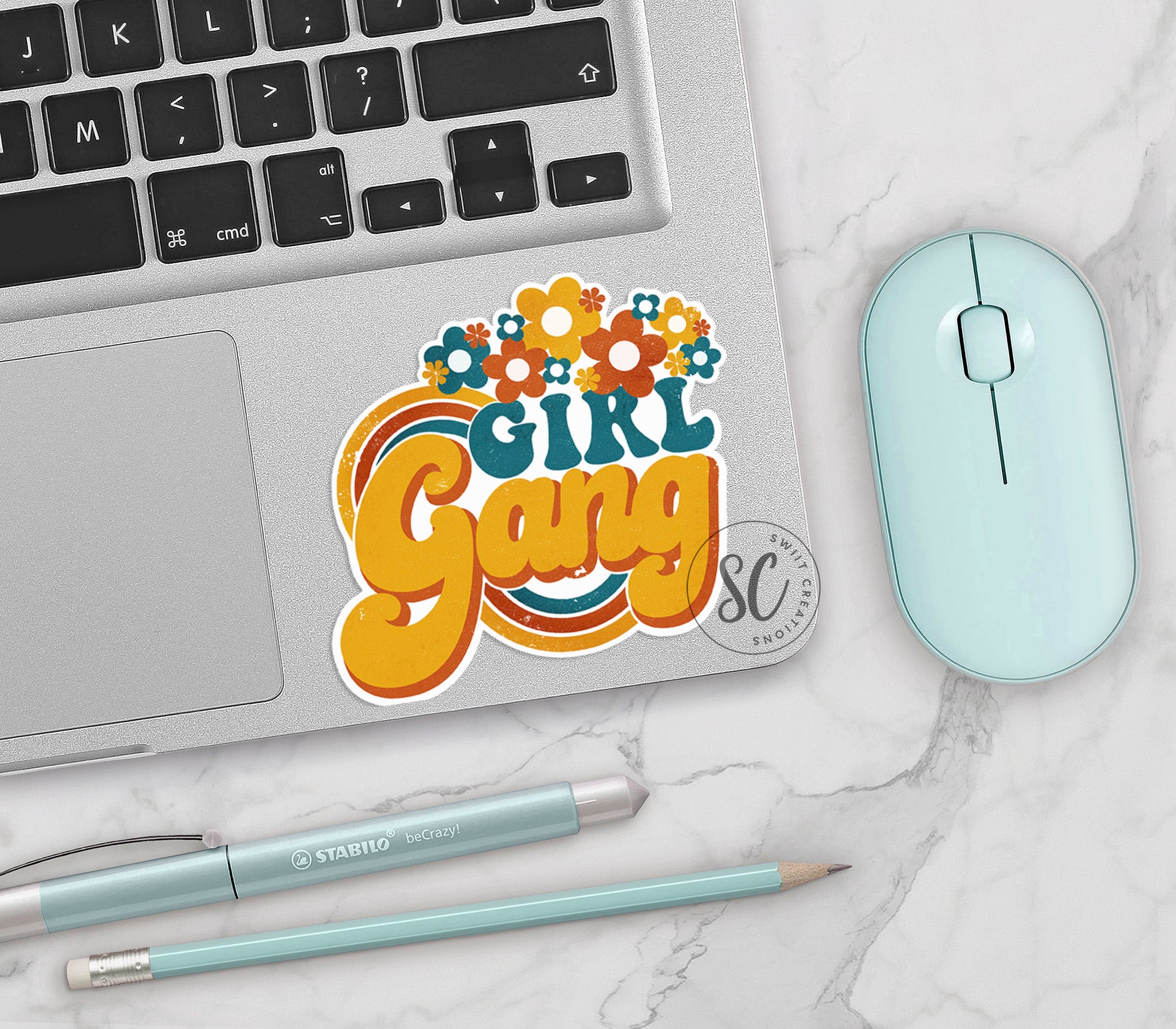 a laptop computer sitting next to a mouse and keyboard