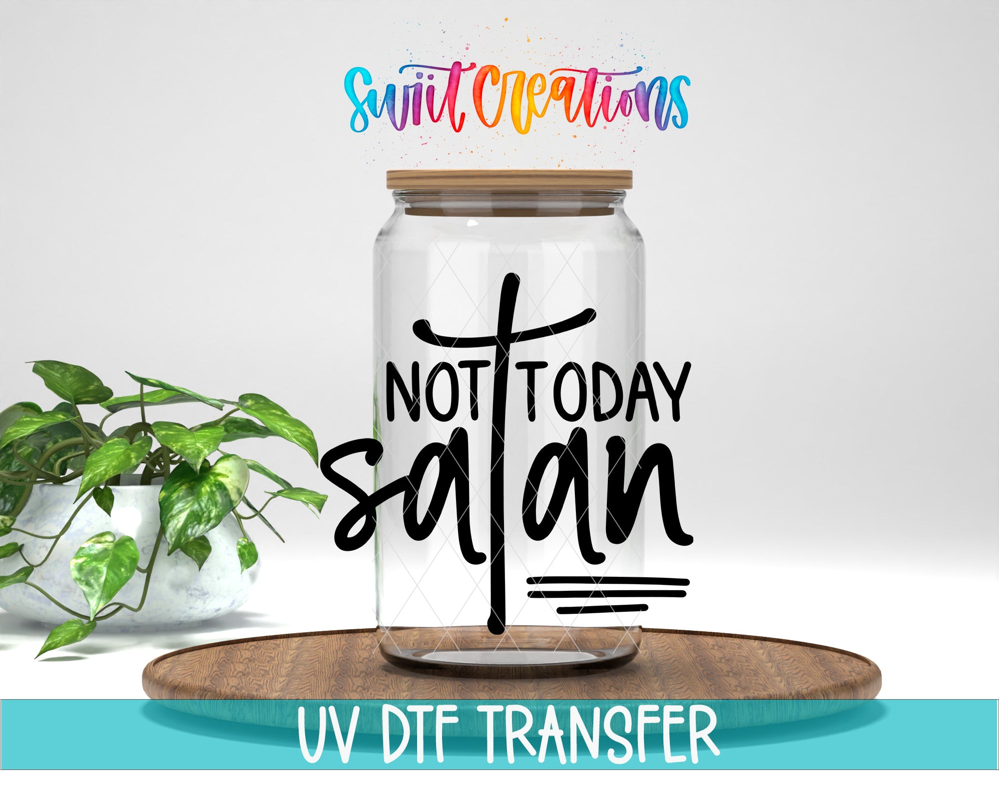 a clear glass jar with a wooden lid, placed on a wooden surface. The jar has a label with the text "NOT TODAY SAVAN" printed on it. There is also a plant in the background.