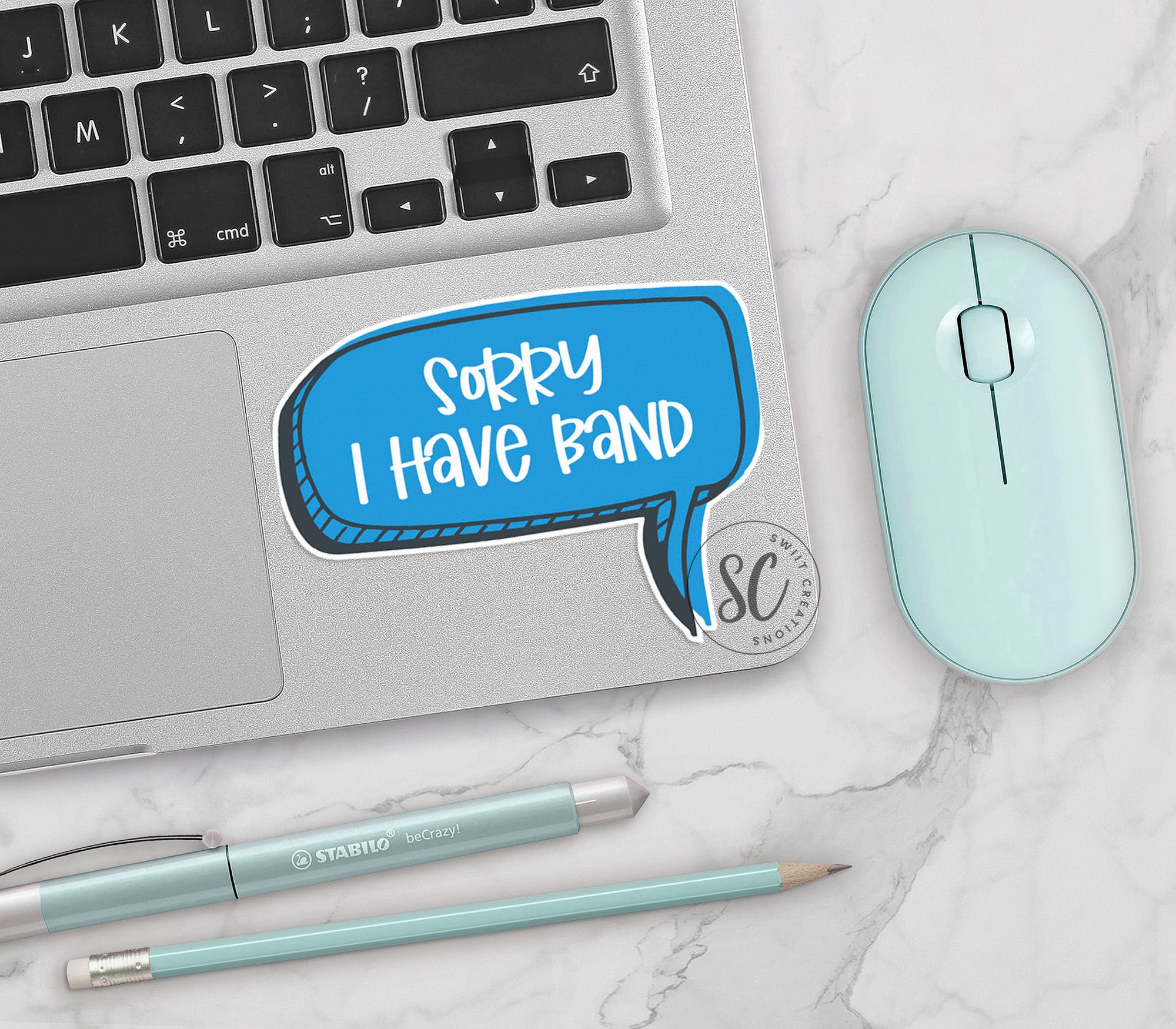 a laptop with a speech bubble sticker on it