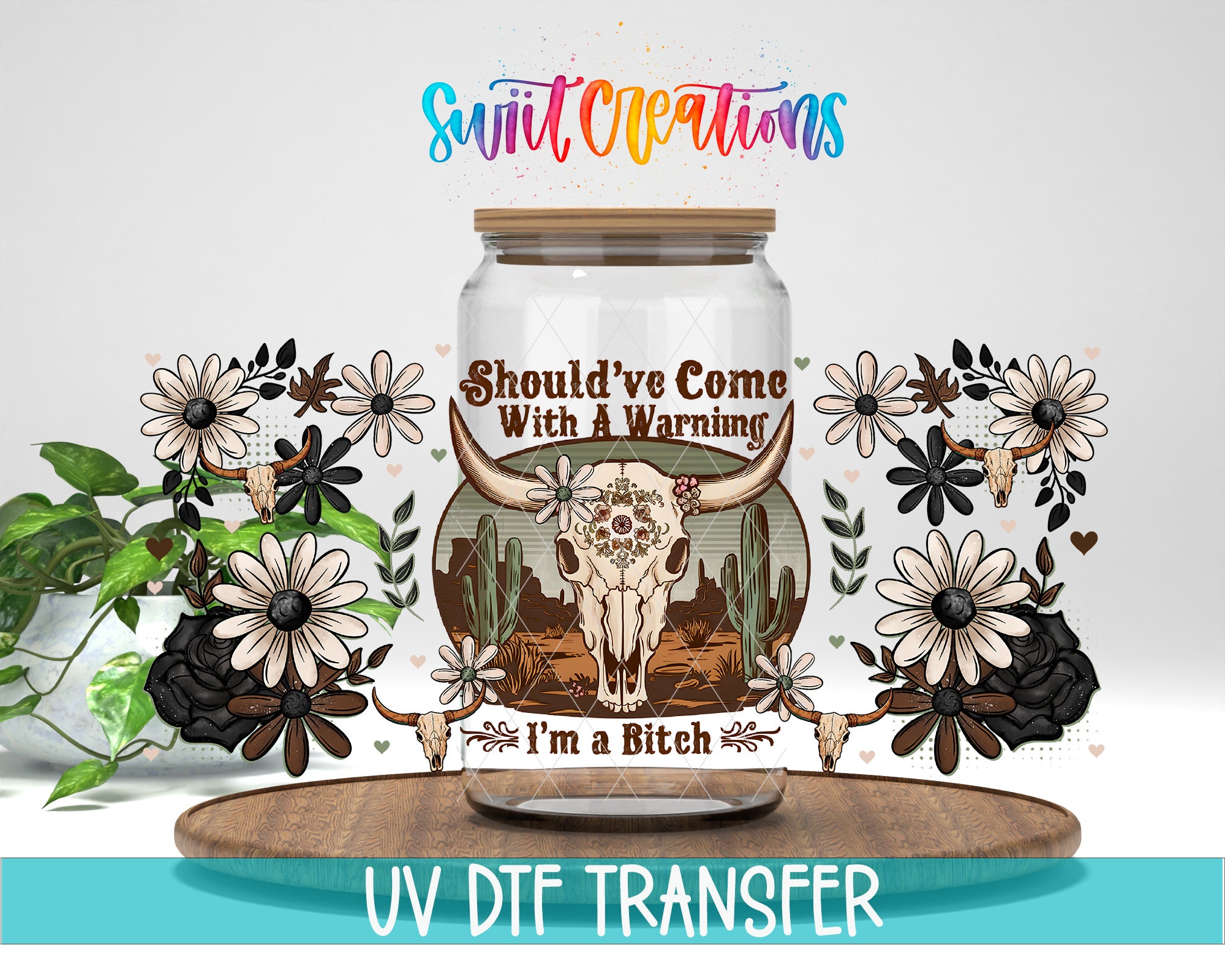 a glass jar with a label that includes a skull and floral designs, along with the text "SHOULD'VE COME WITH A WARNING I'M A BITCH".