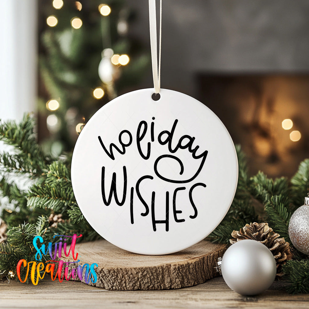 A white ornament with the text "Holiday Wishes" hangs on a wooden surface, surrounded by Christmas decorations such as pine cones and ornaments.