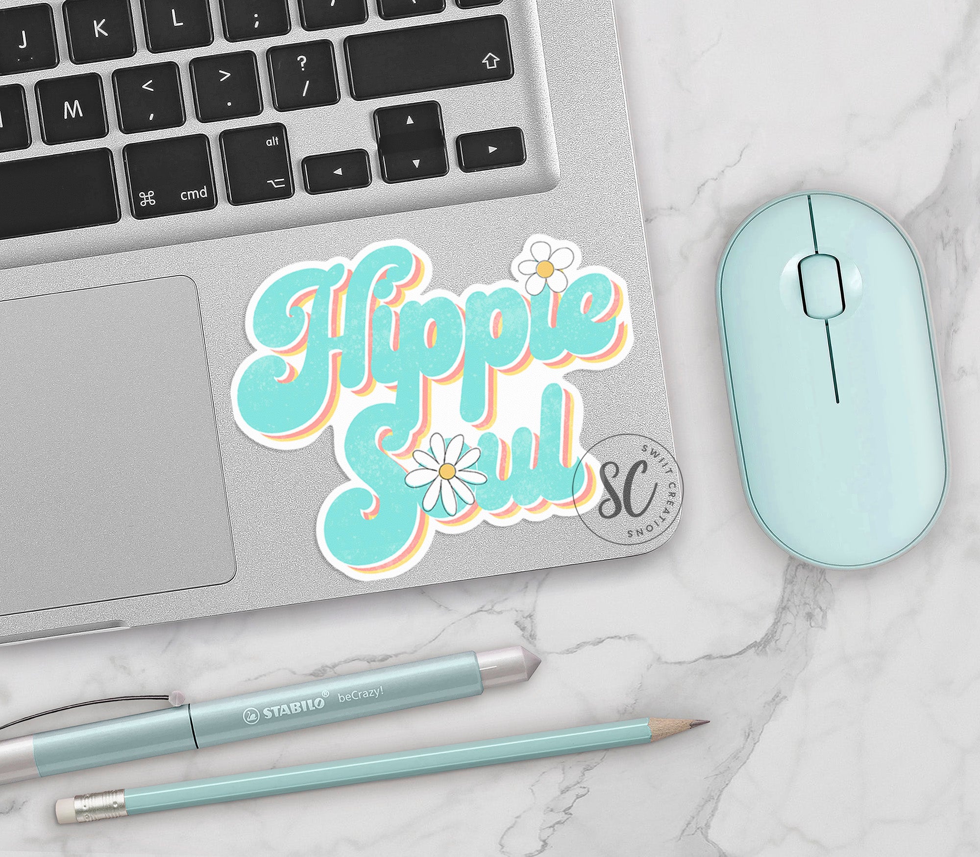 a laptop computer sitting on top of a white table