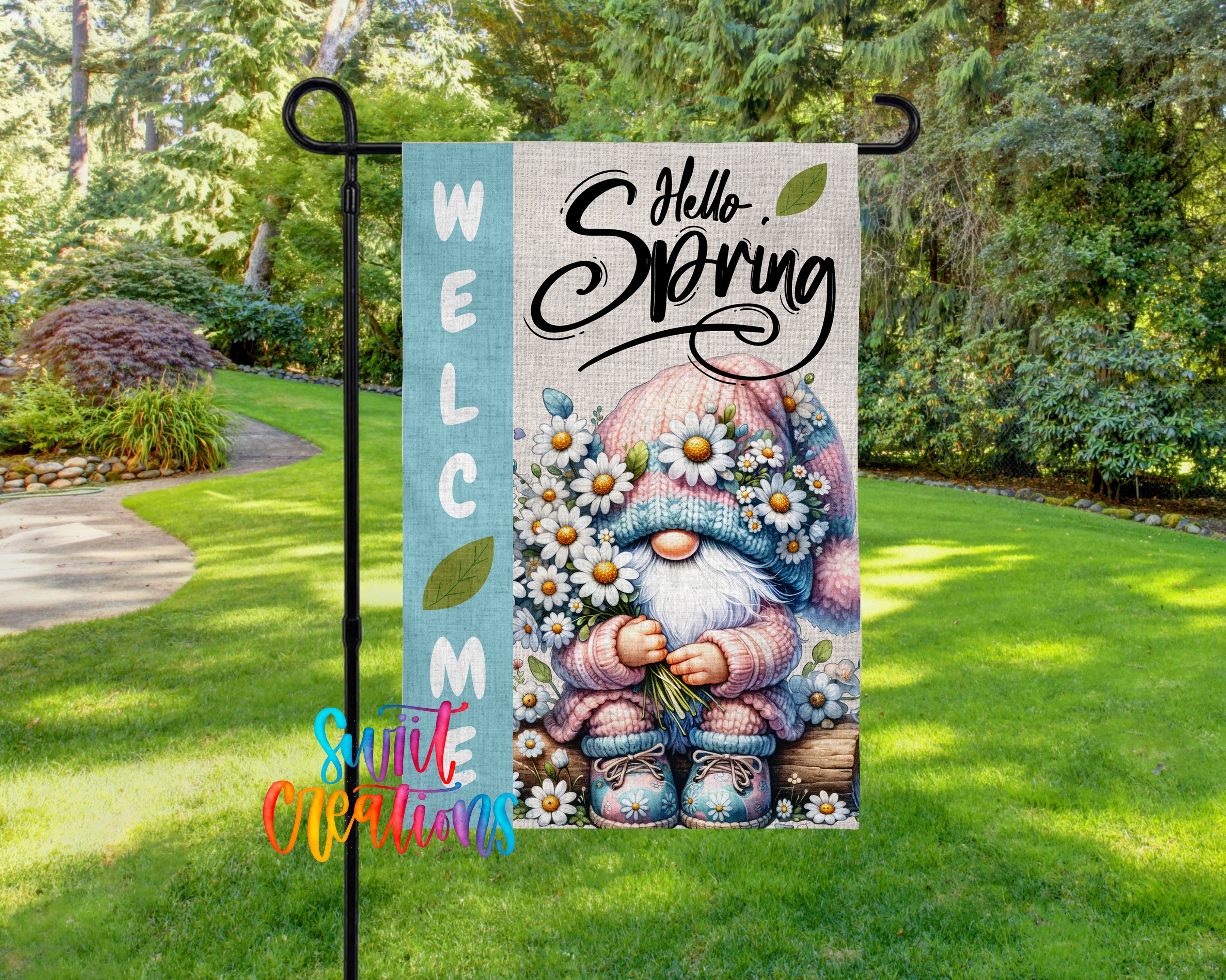 A colorful garden gnome sign welcoming visitors to the garden, surrounded by flowers and greenery.