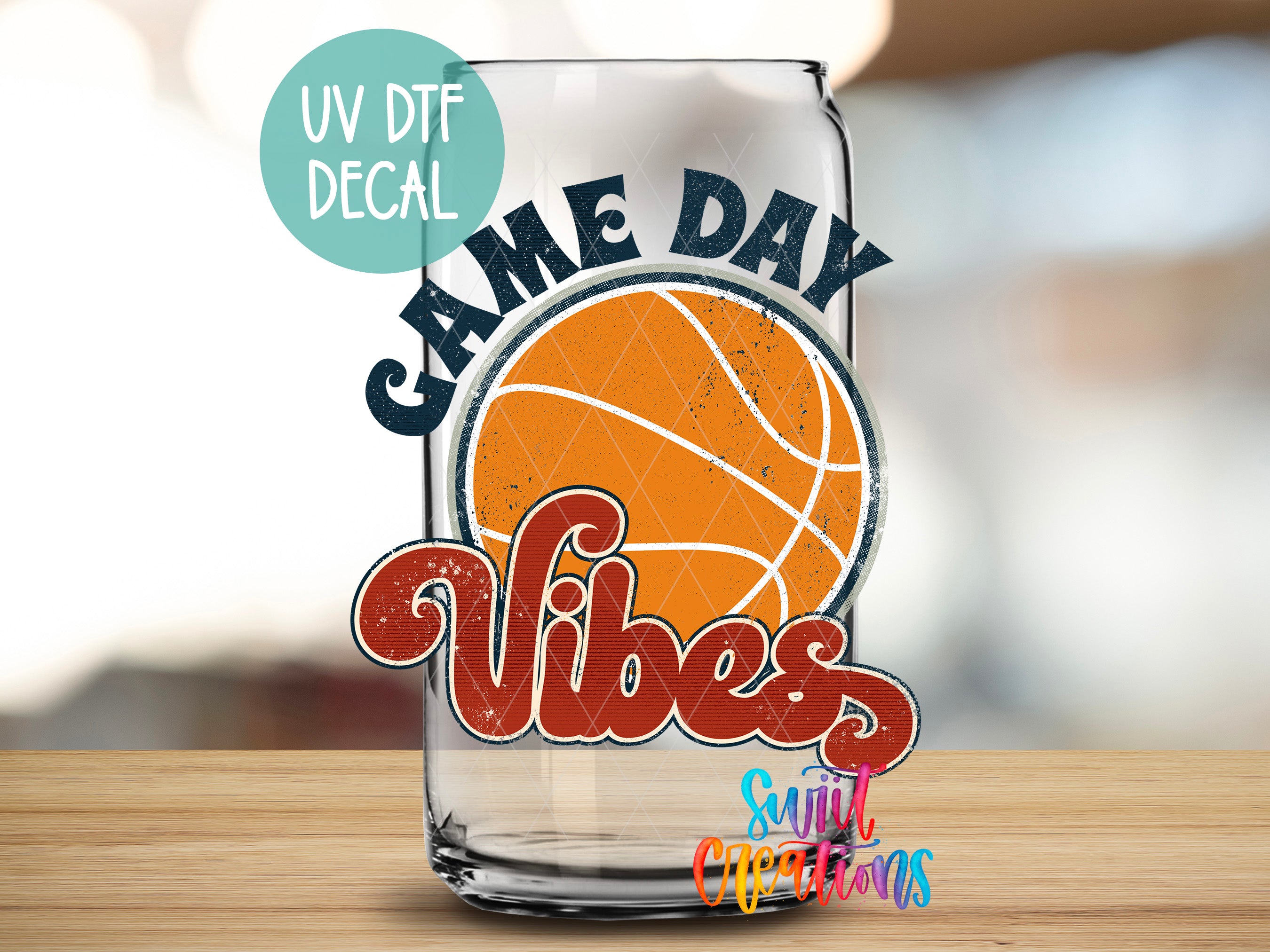 a glass with a basketball on it sitting on a table