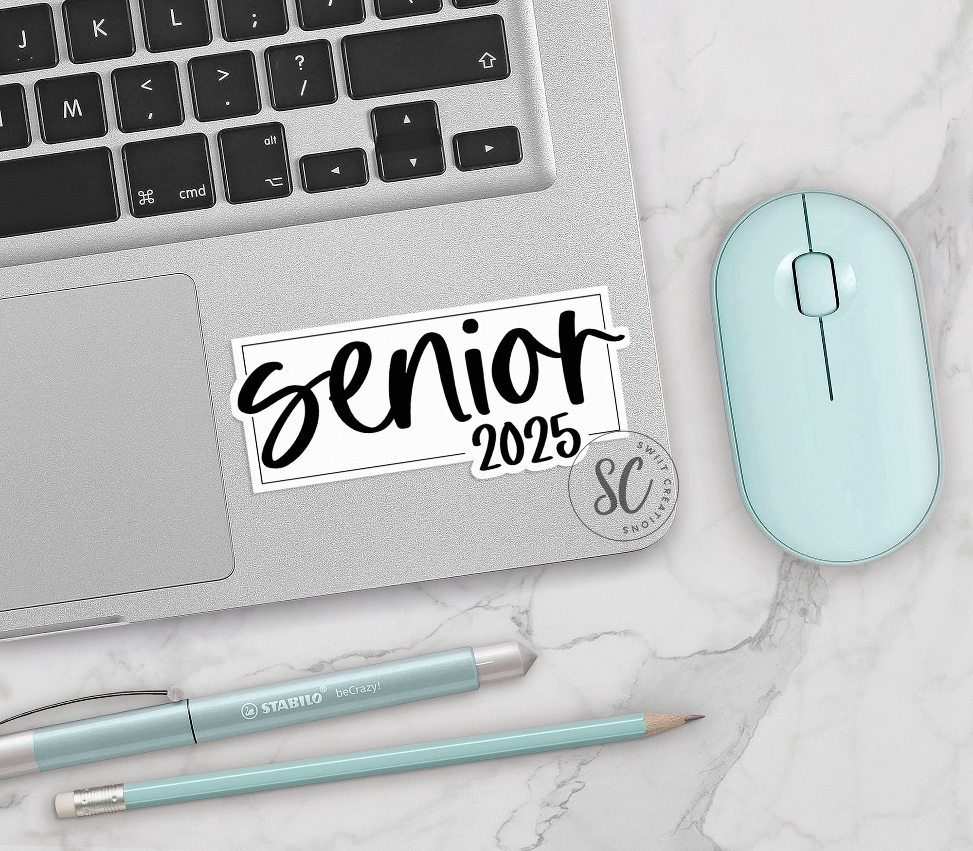 a laptop with a sticker that says senior on it